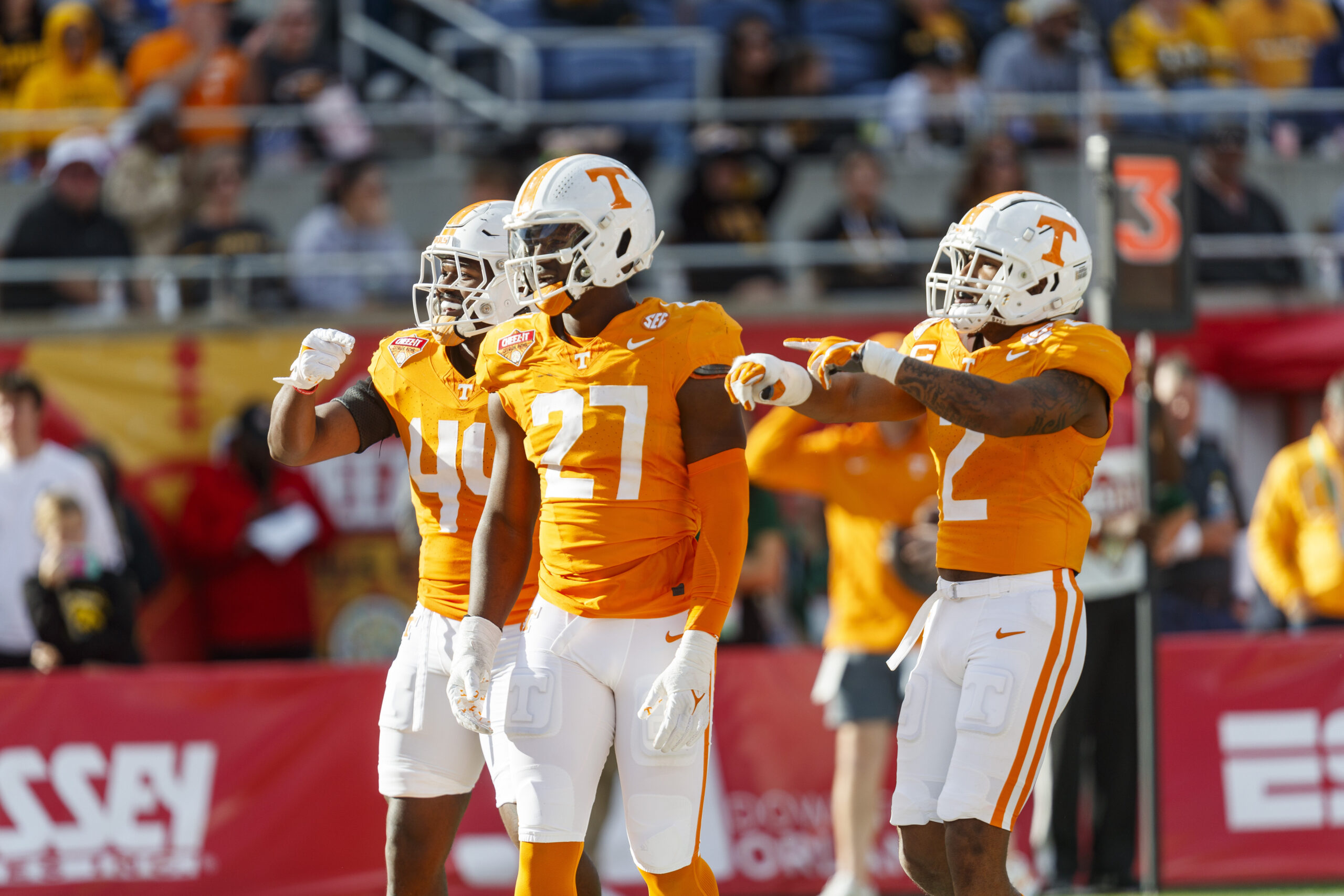 Jan 1, 2024; Orlando, FL, USA; Tennessee Volunteers defensive lineman James Pearce Jr. (27), linebacker Elijah Herring (44) and defensive back Jaylen McCollough (2) celebrate a sack against the Iowa Hawkeyes during the third quarter at Camping World Stadium.