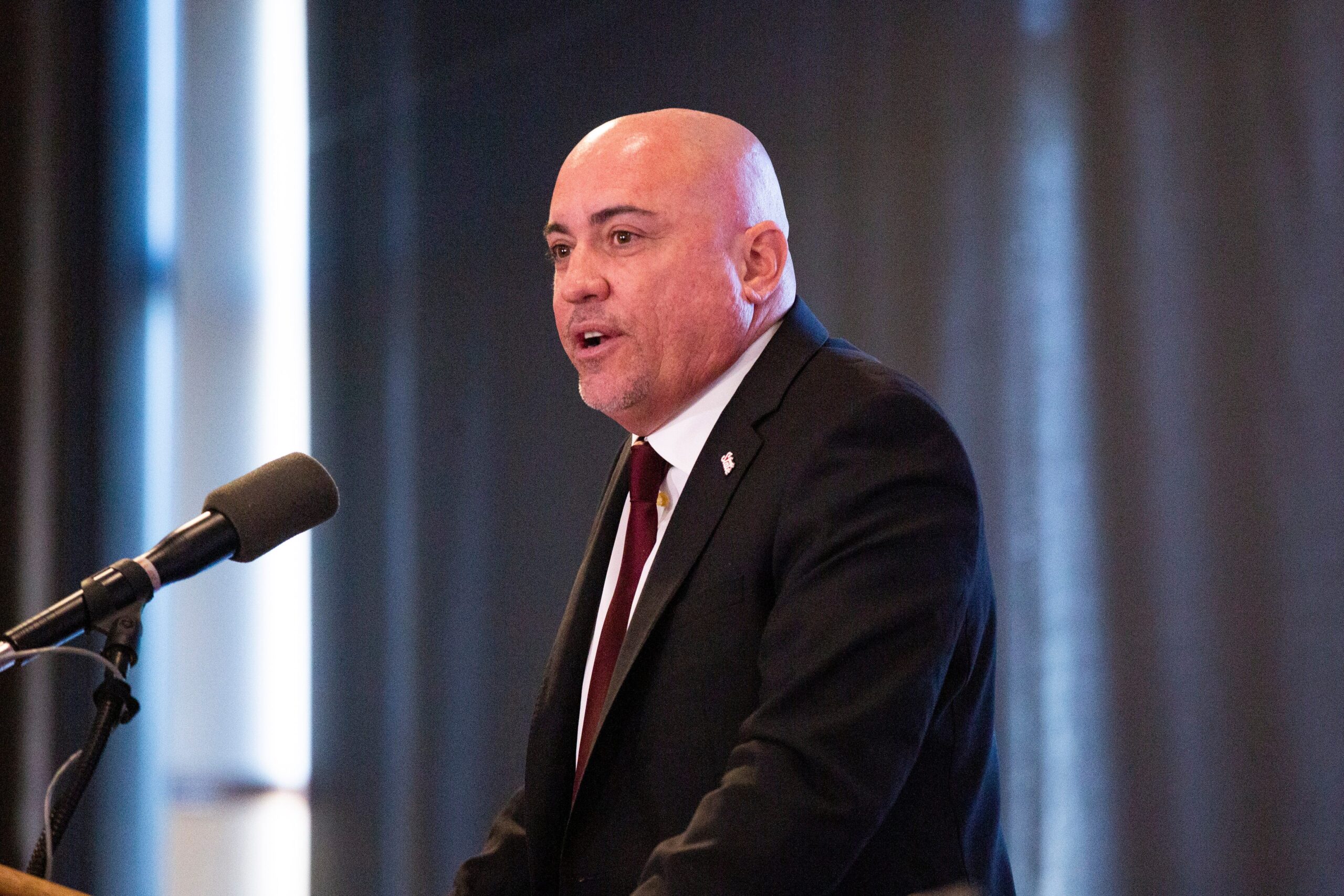 Tony Sanchez, the new head coach of the Aggie football team, speaks to the audience and news media during a news conference on Wednesday, Jan. 3, 2024, at New Mexico State University.  