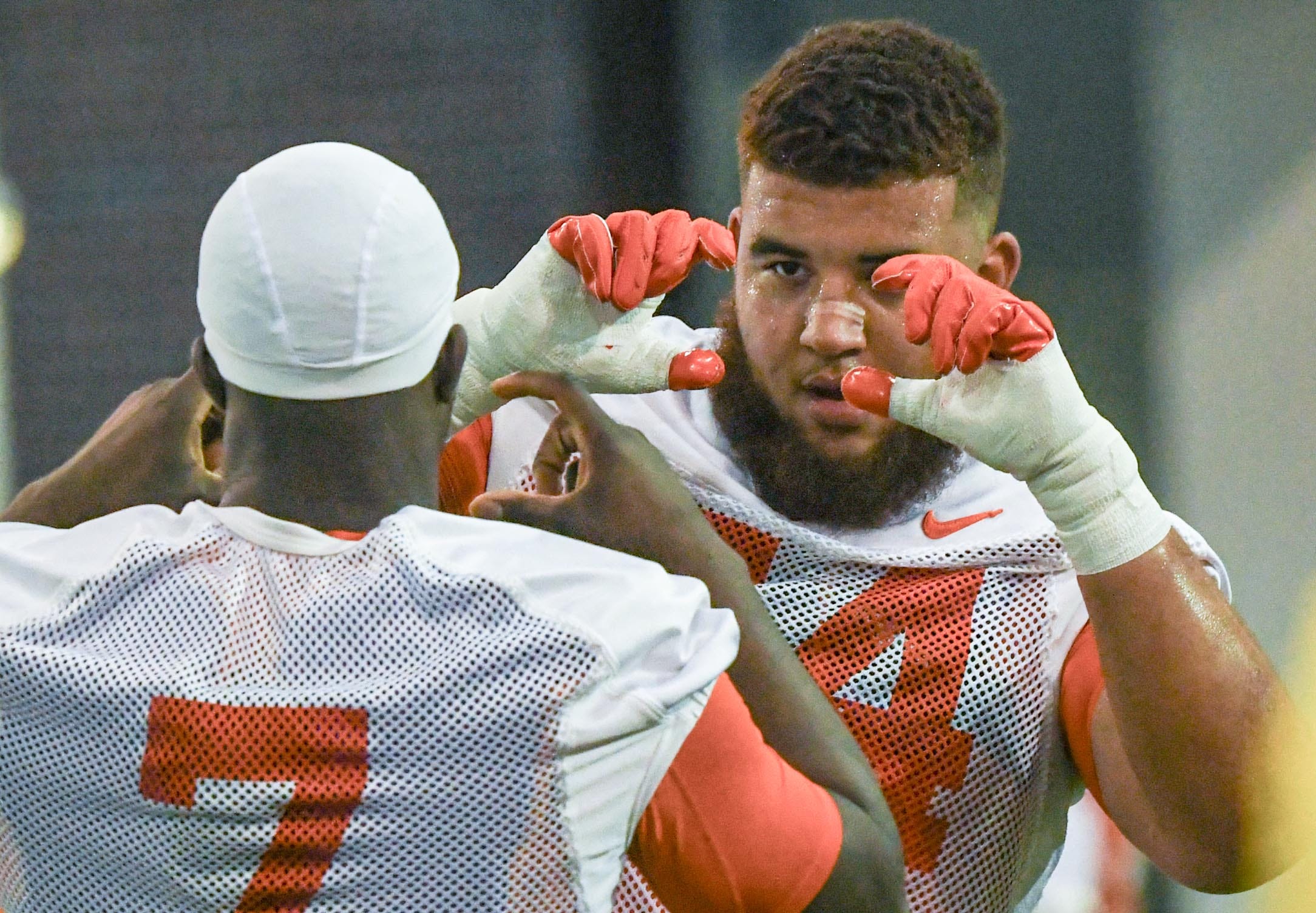 Clemson offensive lineman Marcus Tate (74) pretends to get a photo of running back Phil Mafah (7) during the first day of Spring practice at the Poe Indoor Practice Facility at the Allen N. Reeves football complex in Clemson S.C. Wednesday, February 28, 2024.
