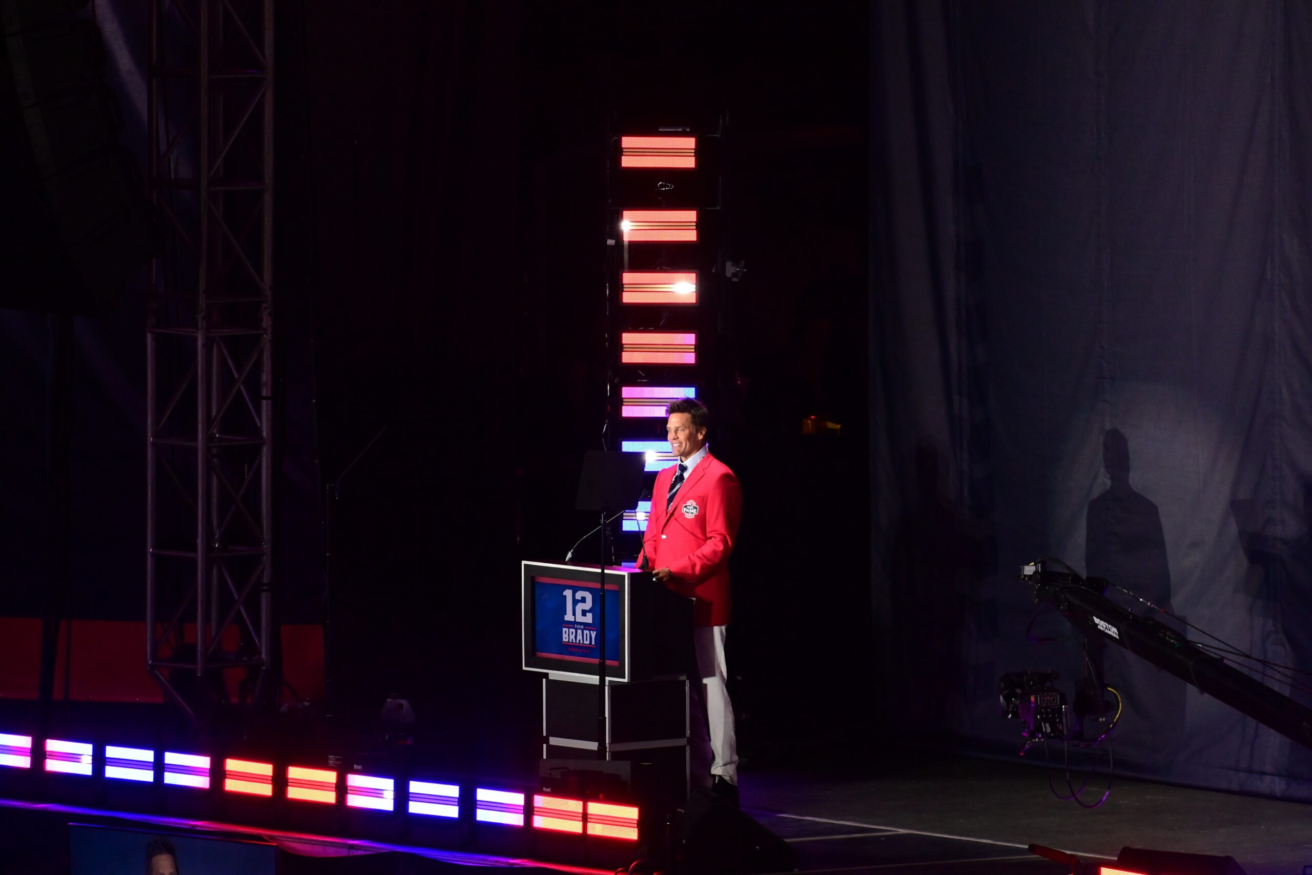 Jun 12, 2024; Foxborough, MA, USA; Former quarterback Tom Brady speaks during his New England Patriots Hall of Fame induction ceremony at Gillette Stadium.