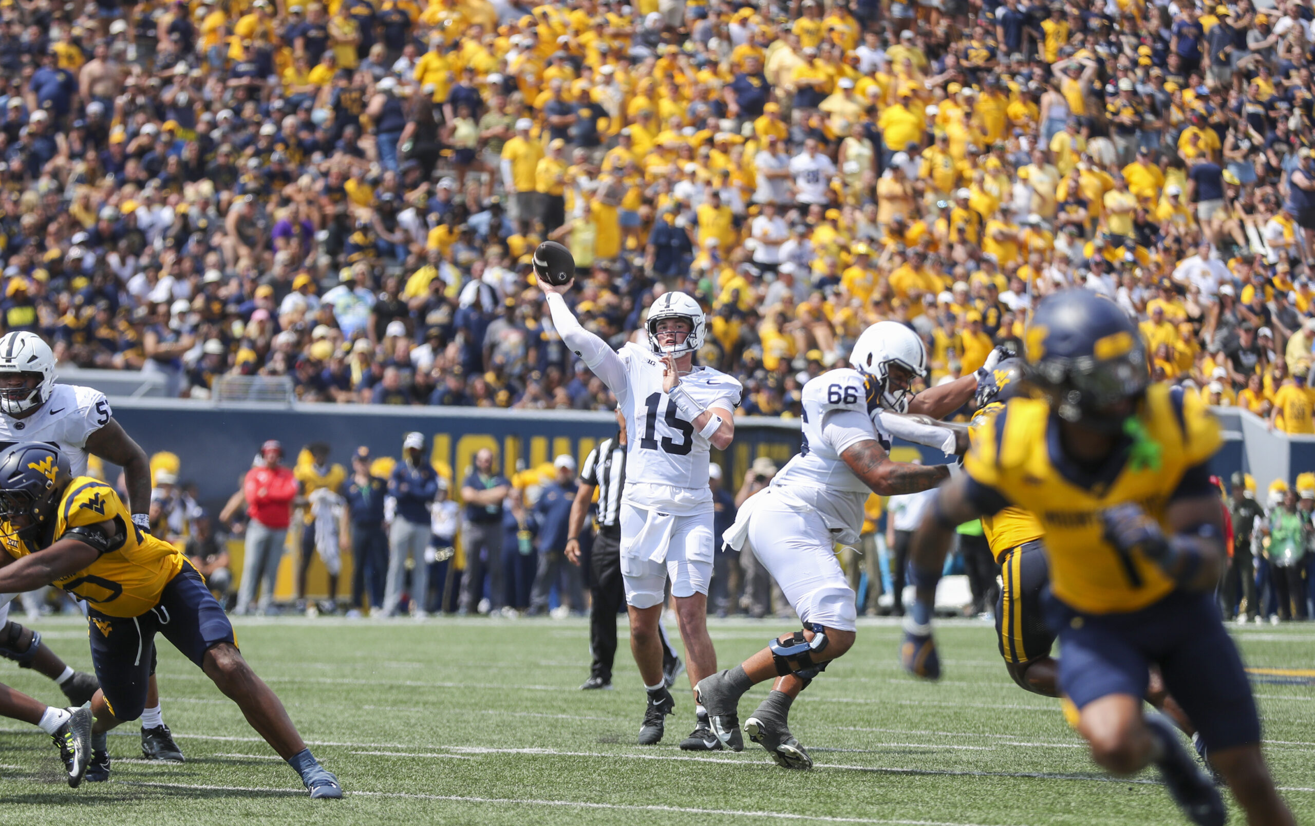 Aug 31, 2024; Morgantown, West Virginia, USA; Penn State Nittany Lions quarterback Drew Allar (15) throws a pass to Penn State Nittany Lions wide receiver Harrison Wallace III (6) for a touchdown during the second quarter against the West Virginia Mountaineers at Mountaineer Field at Milan Puskar Stadium.
