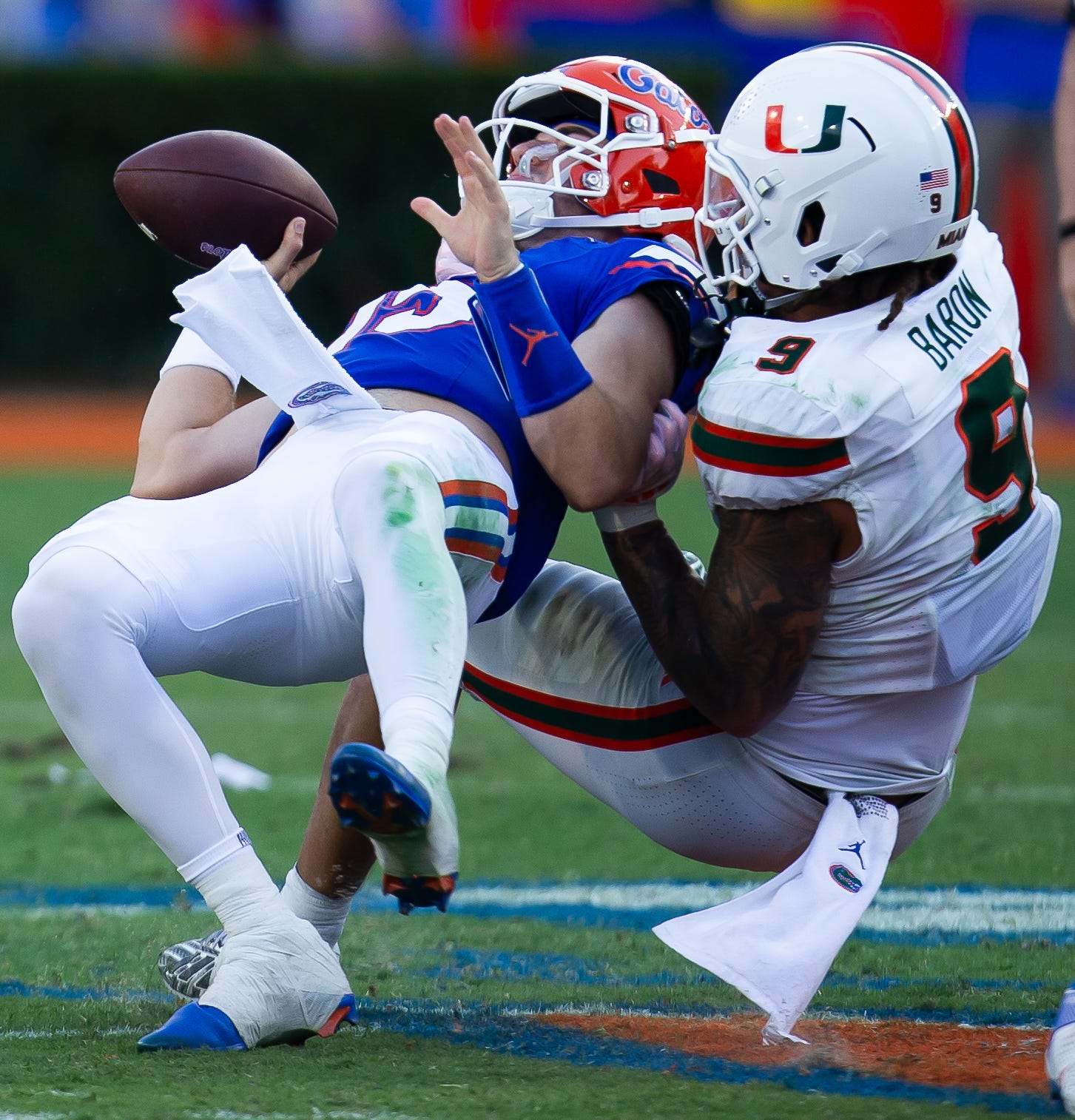 Miami Hurricanes defensive lineman Tyler Baron (9) sacks Florida Gators quarterback Graham Mertz (15) during the season opener at Ben Hill Griffin Stadium in Gainesville, FL on Saturday, August 31, 2024 against the University of Miami Hurricanes in the second half. Miami defeated the Gators 41-17.