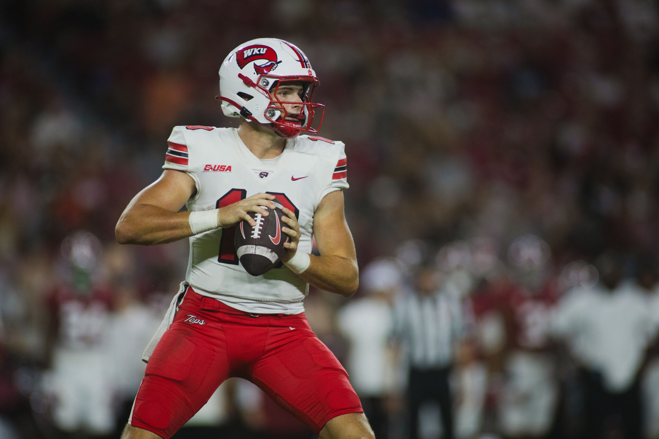 Aug 31, 2024; Tuscaloosa, Alabama, USA; Western Kentucky Hilltoppers quarterback Caden Veltkamp (10) looks for a pass against against the Alabama Crimson Tide at Bryant-Denny Stadium