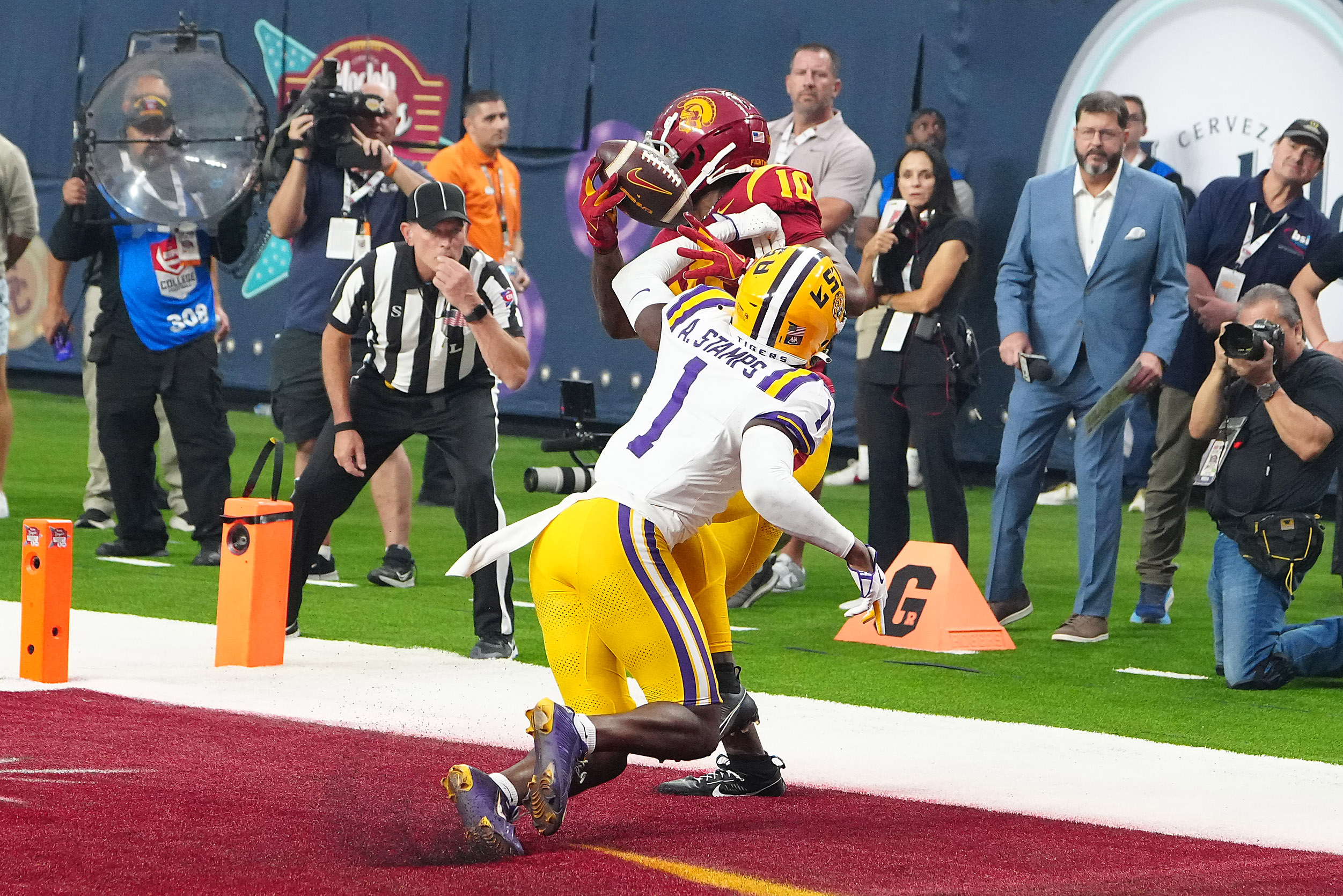 Sep 1, 2024; Paradise, Nevada, USA; A general overall view of helmets at the line of scrimmage as LSU Tigers offensive lineman DJ Chester (79) snaps the ball against the Southern California Trojans in the first half at Allegiant Stadium.