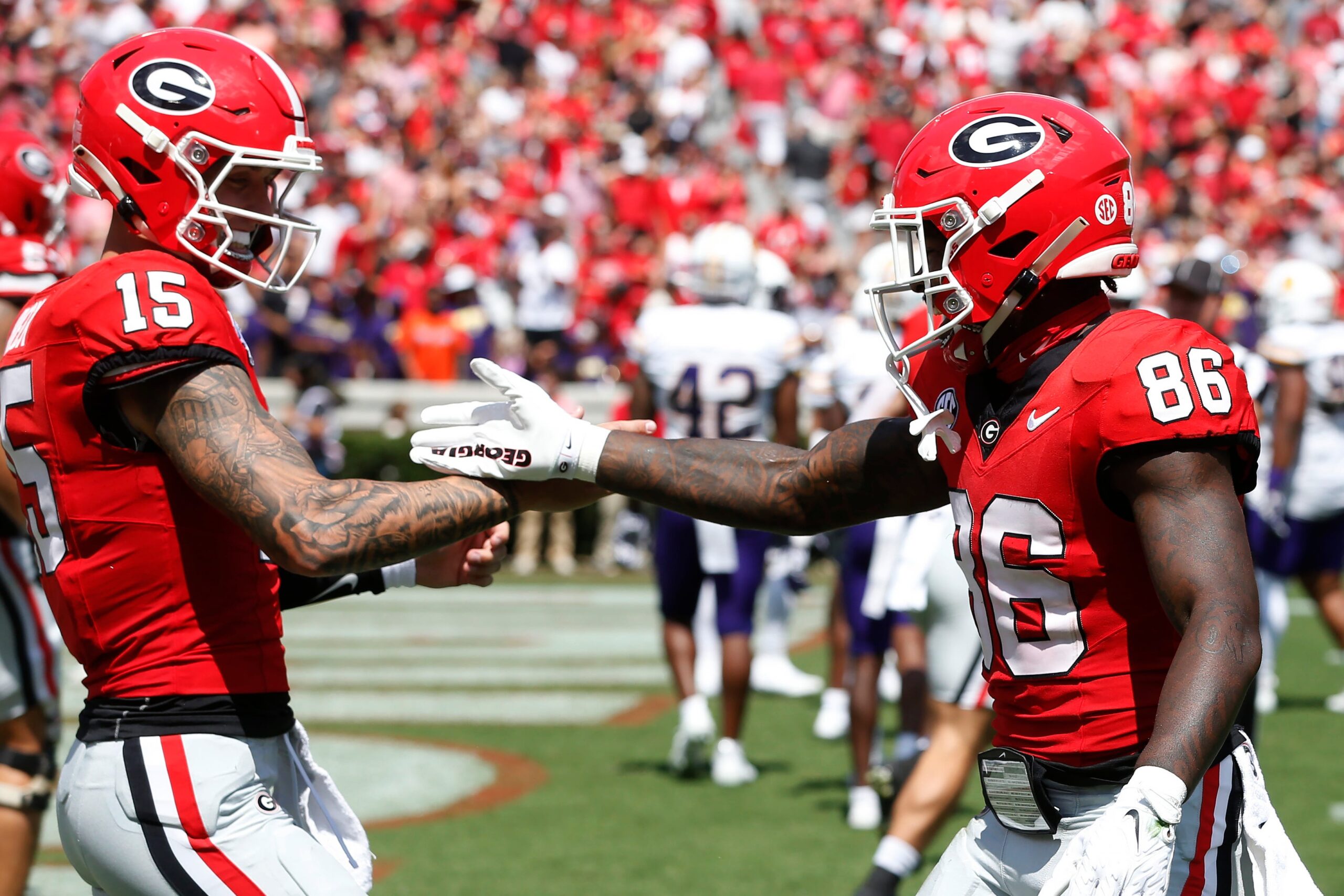 Georgia wide receiver Dillon Bell (86) celebrates with Georgia quarterback Carson Beck (15) after scoring a touchdown during the first half of a NCAA college football game against Tennessee Tech in Athens, on Saturday, Sept. 7, 2024.