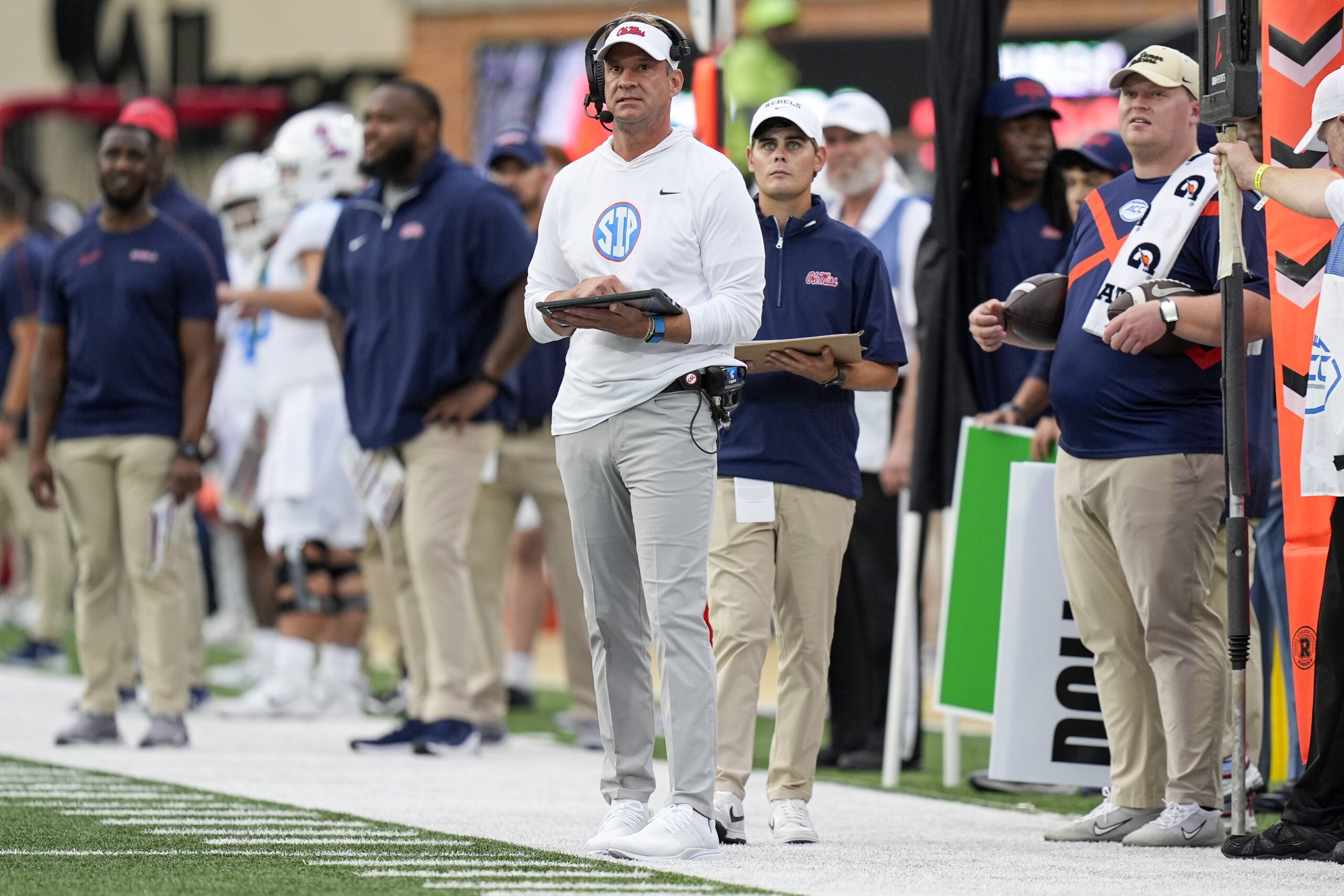 Sep 14, 2024; Winston-Salem, North Carolina, USA; Mississippi Rebels head coach Lane Kiffin looks at the board during the first half against the Wake Forest Demon Deacons at Allegacy Federal Credit Union Stadium.
