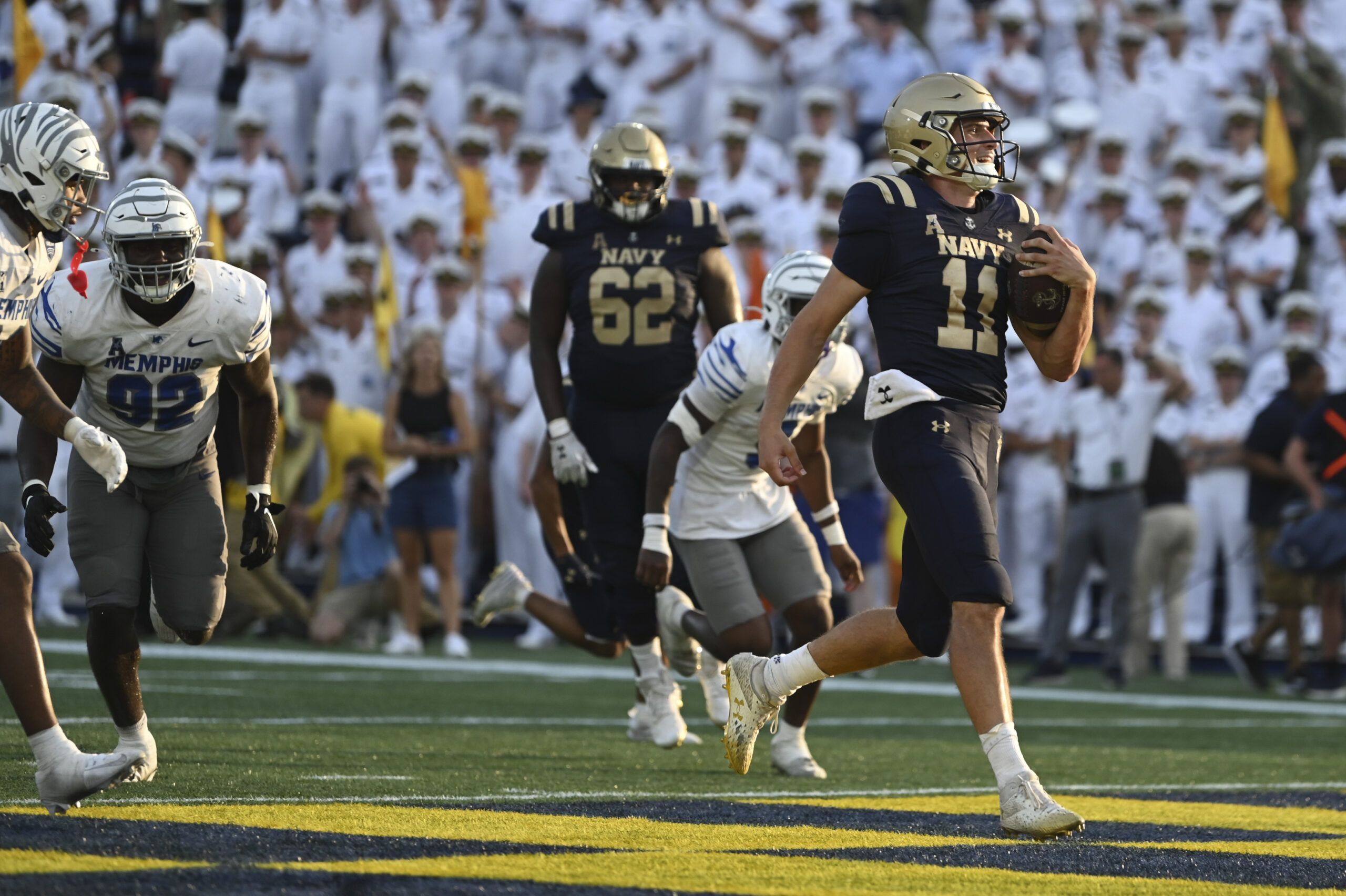 Sep 21, 2024; Annapolis, Maryland, USA; Navy Midshipmen quarterback Blake Horvath (11) scores atouchdown during the second half Memphis Tigers at Navy-Marine Corps Memorial Stadium.