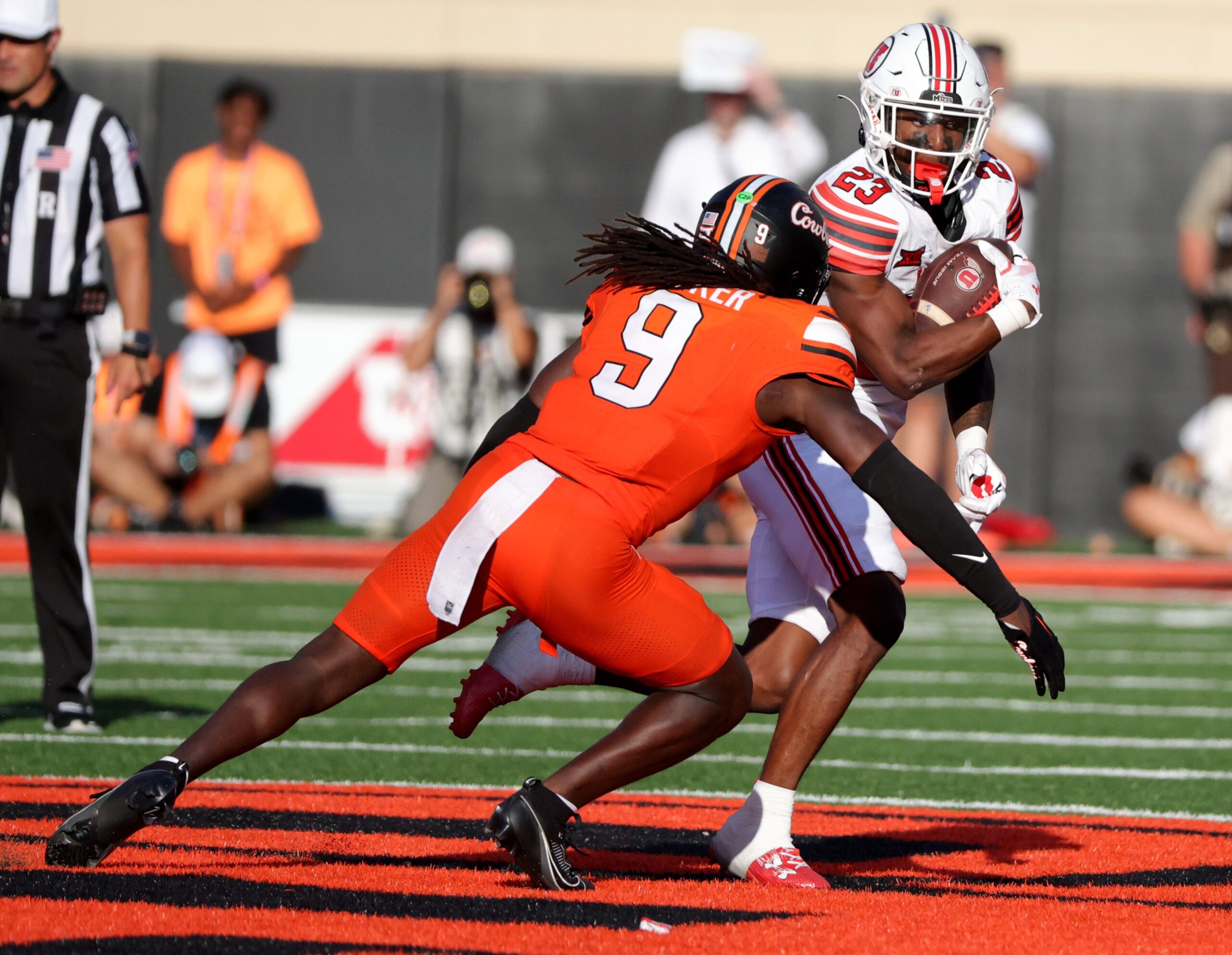 Utah's Dijon Stanley (23) looks to get past Oklahoma State's Trey Rucker (9) in the second half of the college football between the Oklahoma State University Cowboys and the Utah Utes at Boone Pickens Stadium in Stillwater, Okla., Saturday, Sept., 21, 2024.