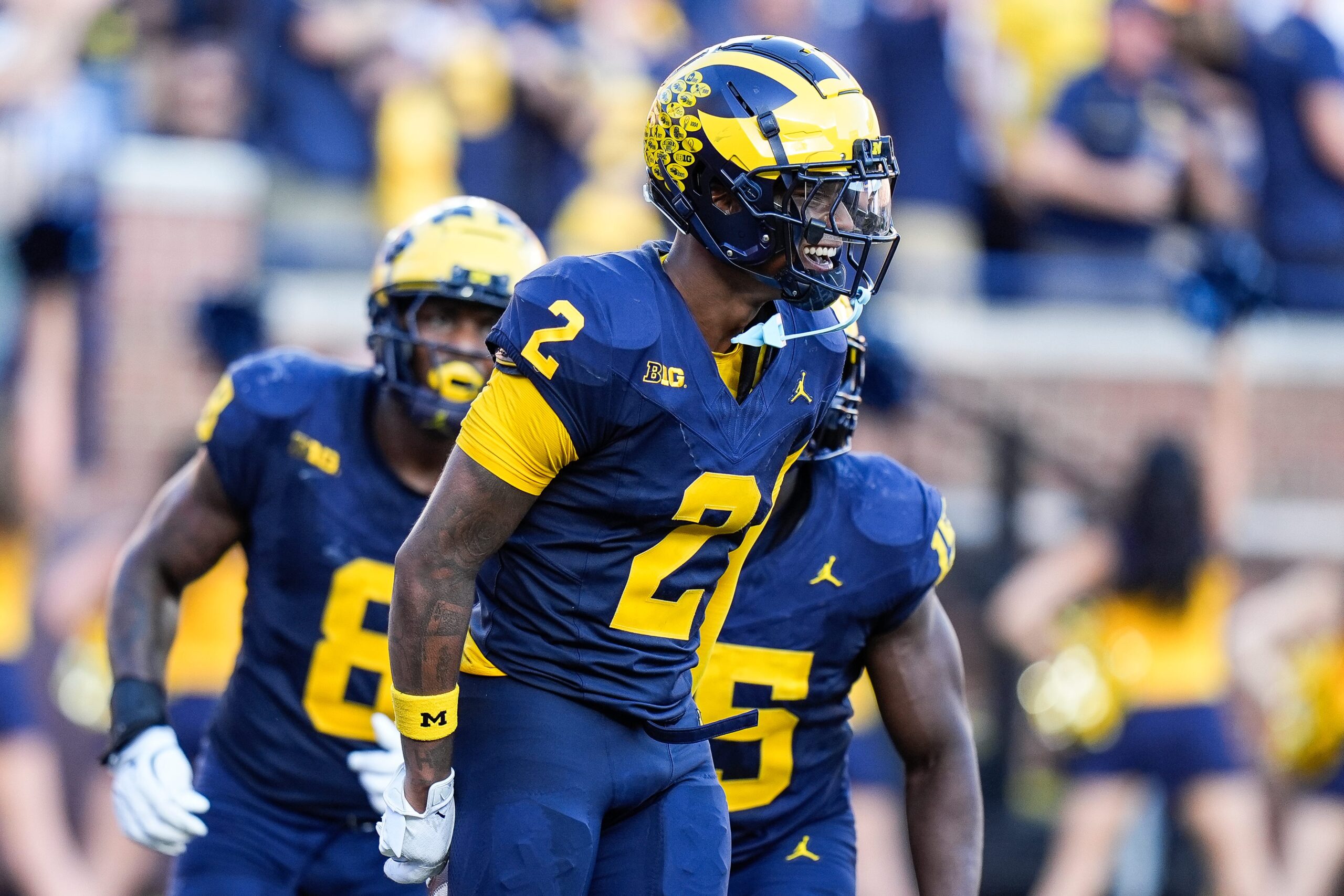 Michigan defensive back Will Johnson (2) celebrates a touchdown after intercepting USC quarterback Miller Moss (7) during the second half at Michigan Stadium in Ann Arbor on Saturday, Sept. 21, 2024.