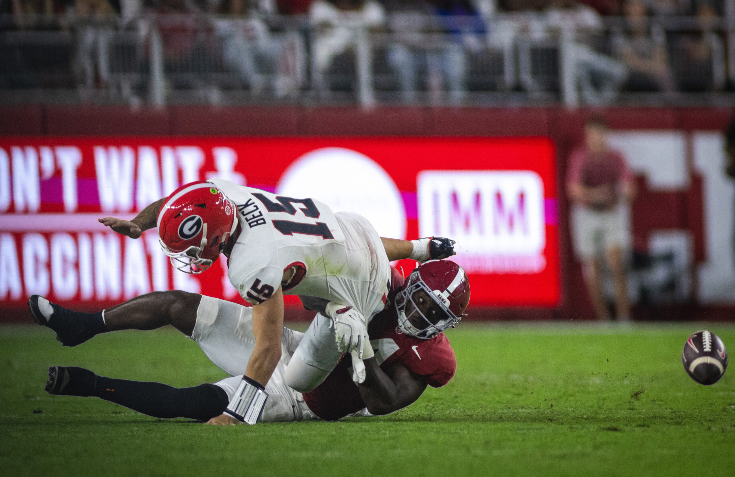 Sep 28, 2024; Tuscaloosa, Alabama, USA; Alabama Crimson Tide linebacker Qua Russaw (4) causes a fumble by Georgia Bulldogs quarterback Carson Beck (15) during the third quarter at Bryant-Denny Stadium. 