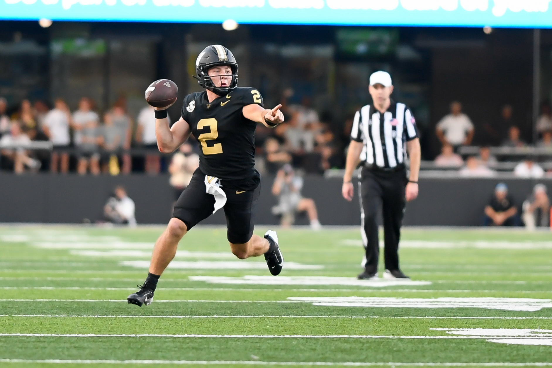 Oct 5, 2024; Nashville, Tennessee, USA; Vanderbilt Commodores quarterback Diego Pavia (2) scrambles against the Alabama Crimson Tide during the second half at FirstBank Stadium.
