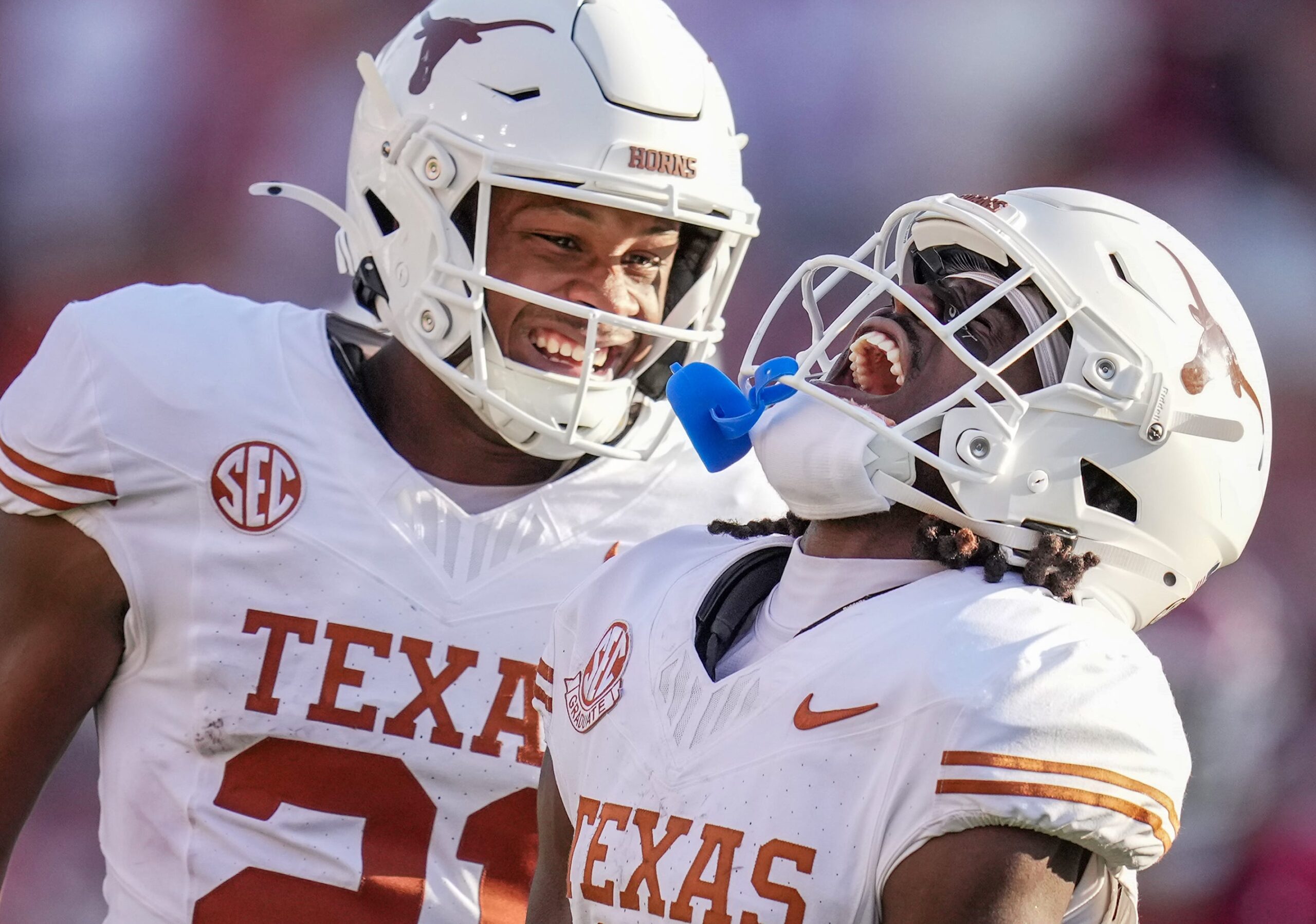Texas Longhorns wide receiver Silas Bolden (11) and Texas Longhorns defensive back Xavier Filsaime (21) celebrates a touchdown in the third quarter during the Red River Rivalry Football Game between the University of Oklahoma Sooners and the University of Texas Longhorns at the Cotton Bowl Stadium in Dallas, TX Saturday, Oct. 12, 2024.