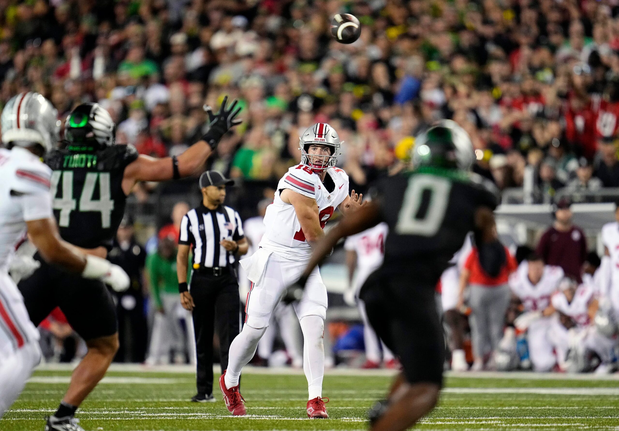 Oct 12, 2024; Eugene, Oregon, USA; Ohio State Buckeyes quarterback Will Howard (18) throws the ball against the Oregon Ducks defense in the second half during the NCAA football game at Autzen Stadium.