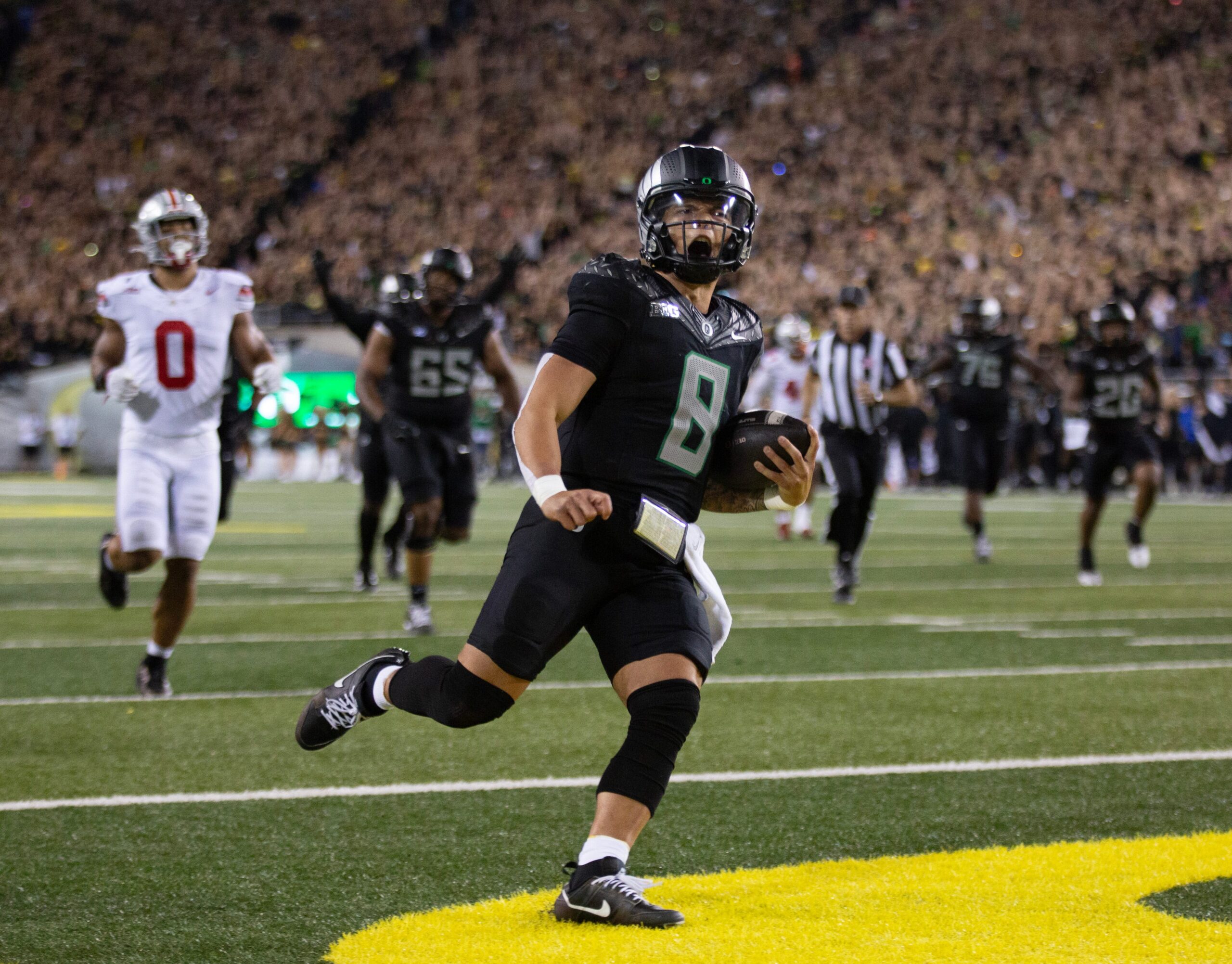 Oregon quarterback Dillon Gabriel scores a touchdown against Ohio State in the fourth quarter at Autzen Stadium Saturday, Oct. 12, 2024.