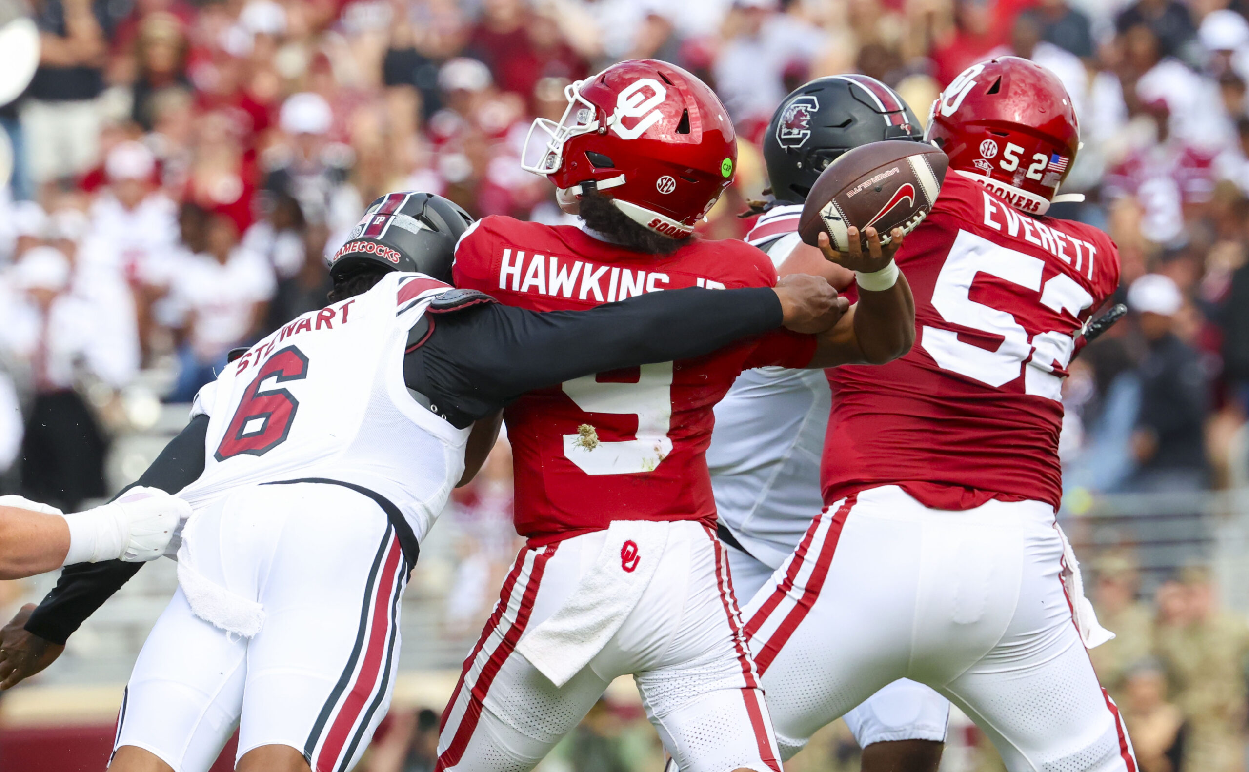 Oct 19, 2024; Norman, Oklahoma, USA; South Carolina Gamecocks edge Dylan Stewart (6) hits Oklahoma Sooners quarterback Michael Hawkins Jr. (9) and causes an interception during the first half at Gaylord Family-Oklahoma Memorial Stadium.