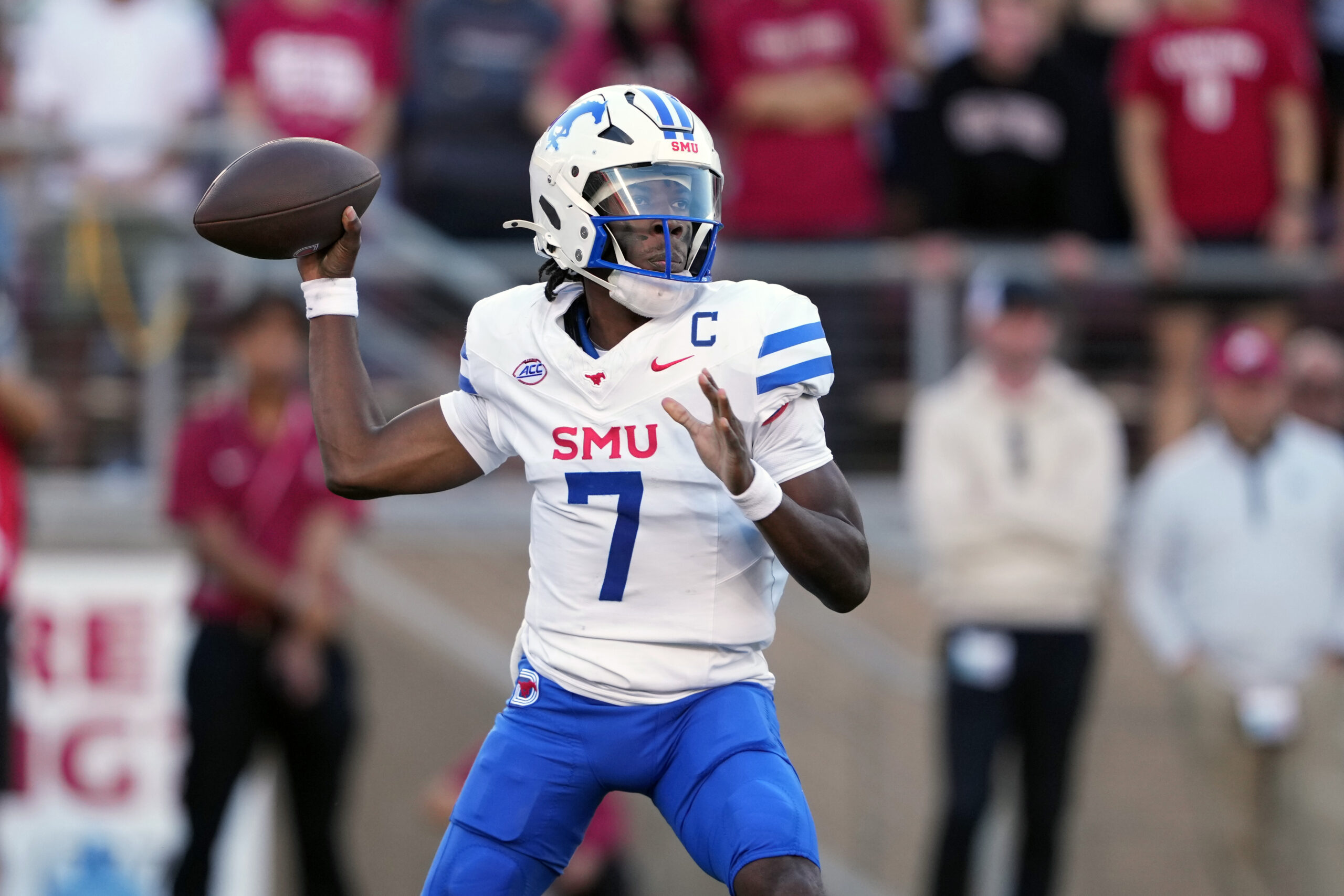Oct 19, 2024; Stanford, California, USA; Southern Methodist Mustangs quarterback Kevin Jennings (7) throws a pass against the Stanford Cardinal during the first quarter at Stanford Stadium.
