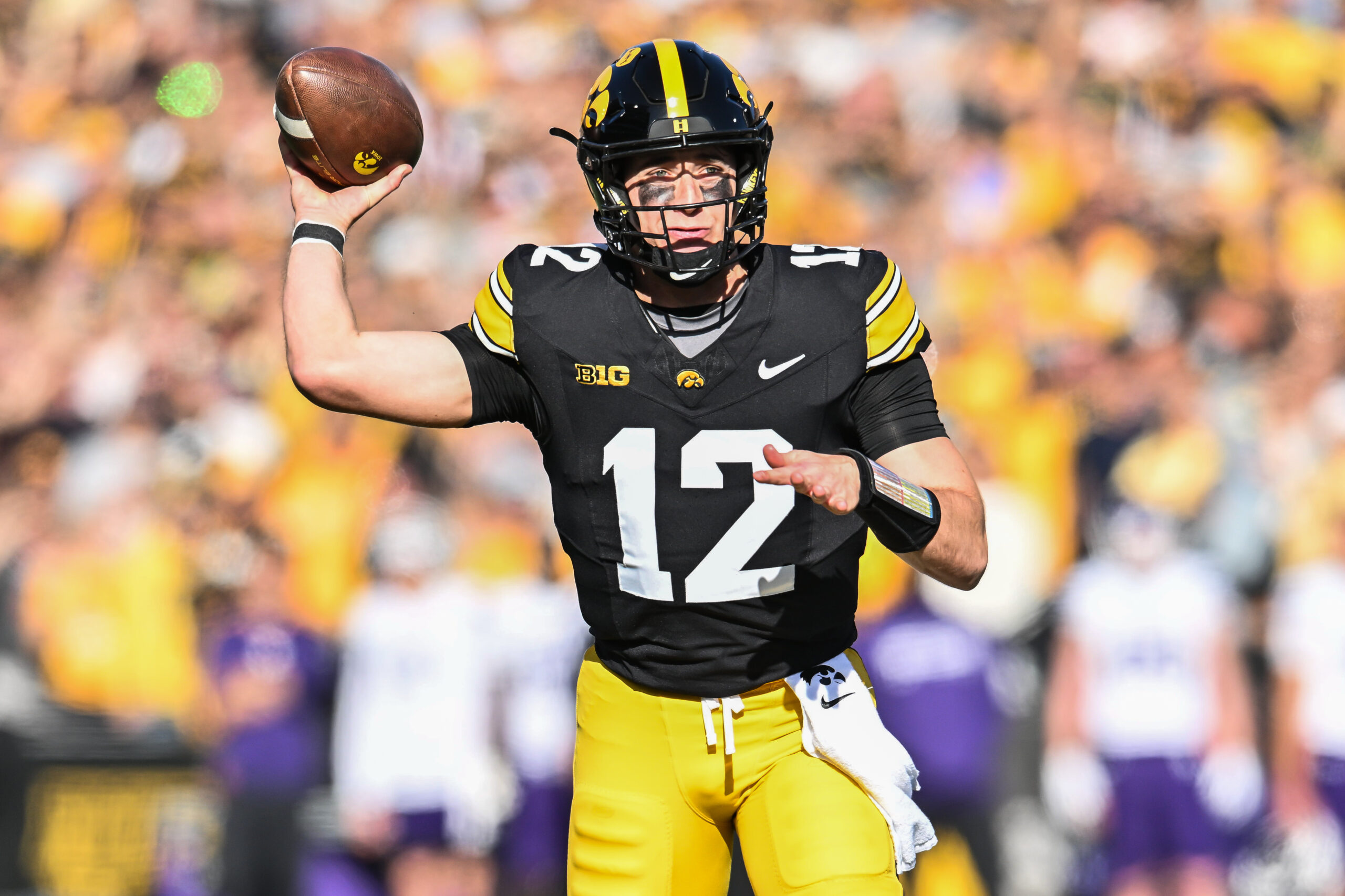 Oct 26, 2024; Iowa City, Iowa, USA; Iowa Hawkeyes quarterback Cade McNamara throws a pass against the Northwestern Wildcats during the first quarter at Kinnick Stadium. Mandatory Credit: Jeffrey Becker-Imagn Images