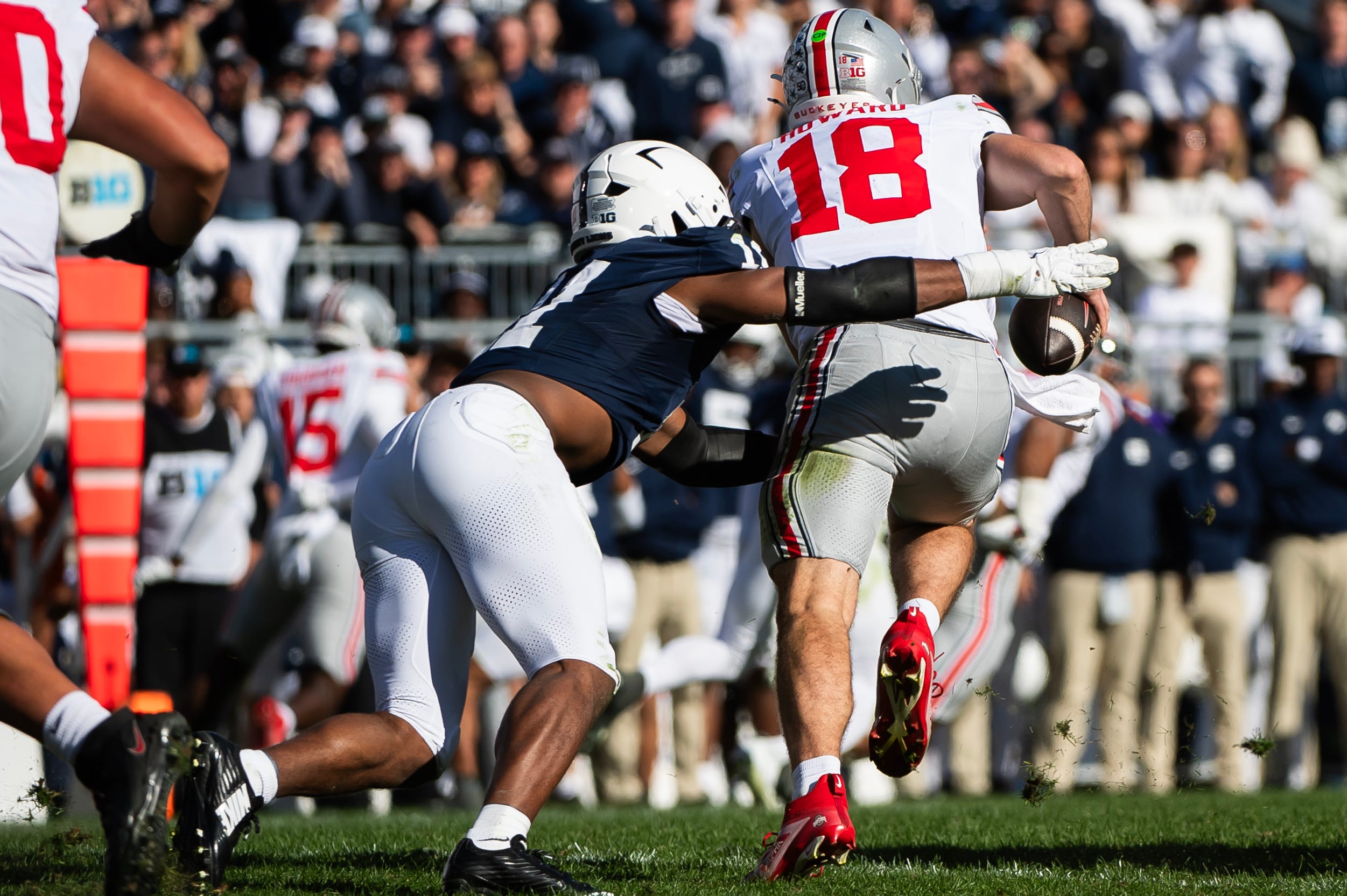 Penn State's Abdul Carter (11) sacks Ohio State quarterback Will Howard in the second half of an NCAA football game, Saturday, Nov. 2, 2024, in State College, Pa.