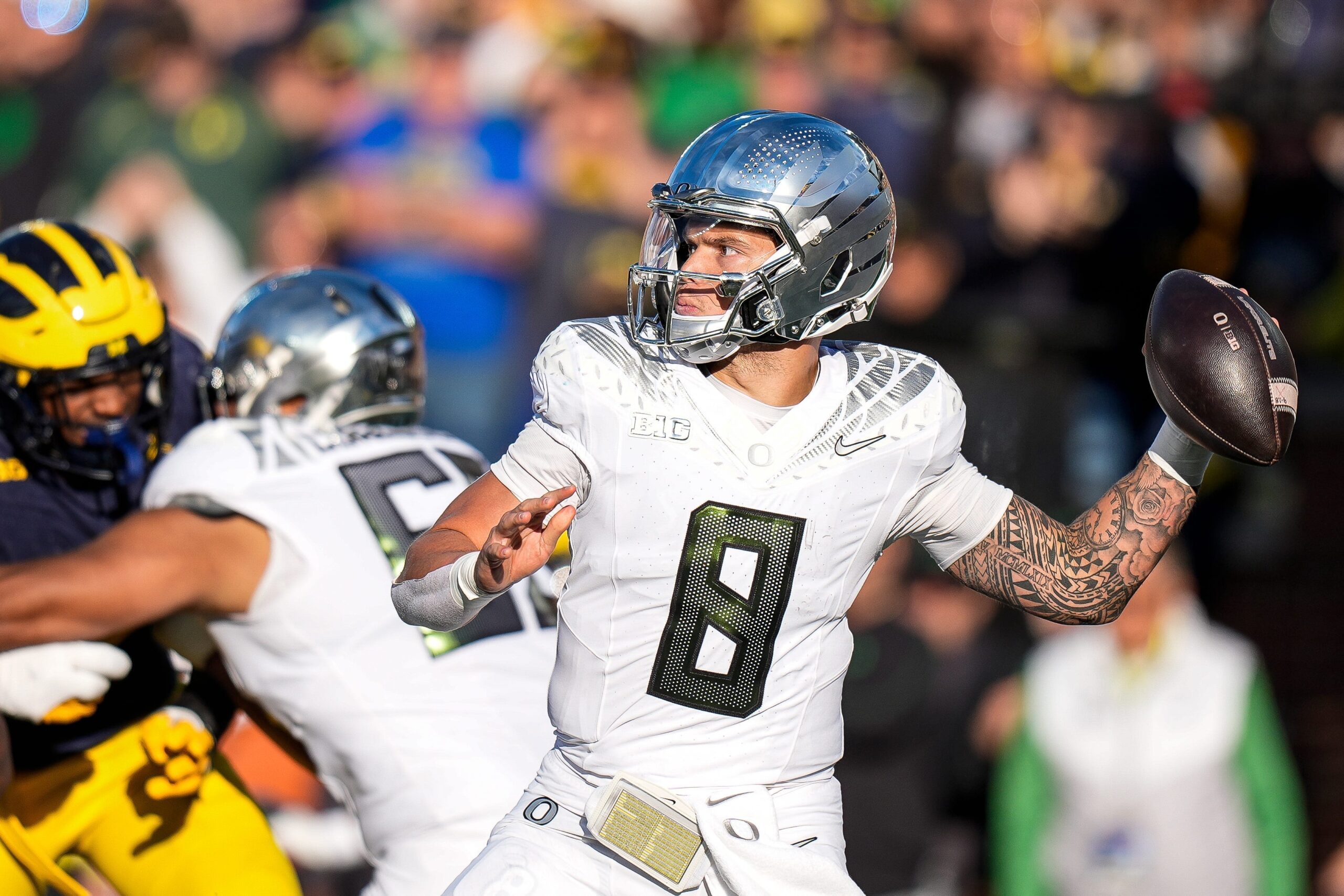 Oregon quarterback Dillon Gabriel makes a pass against Michigan during the first half at Michigan Stadium in Ann Arbor.