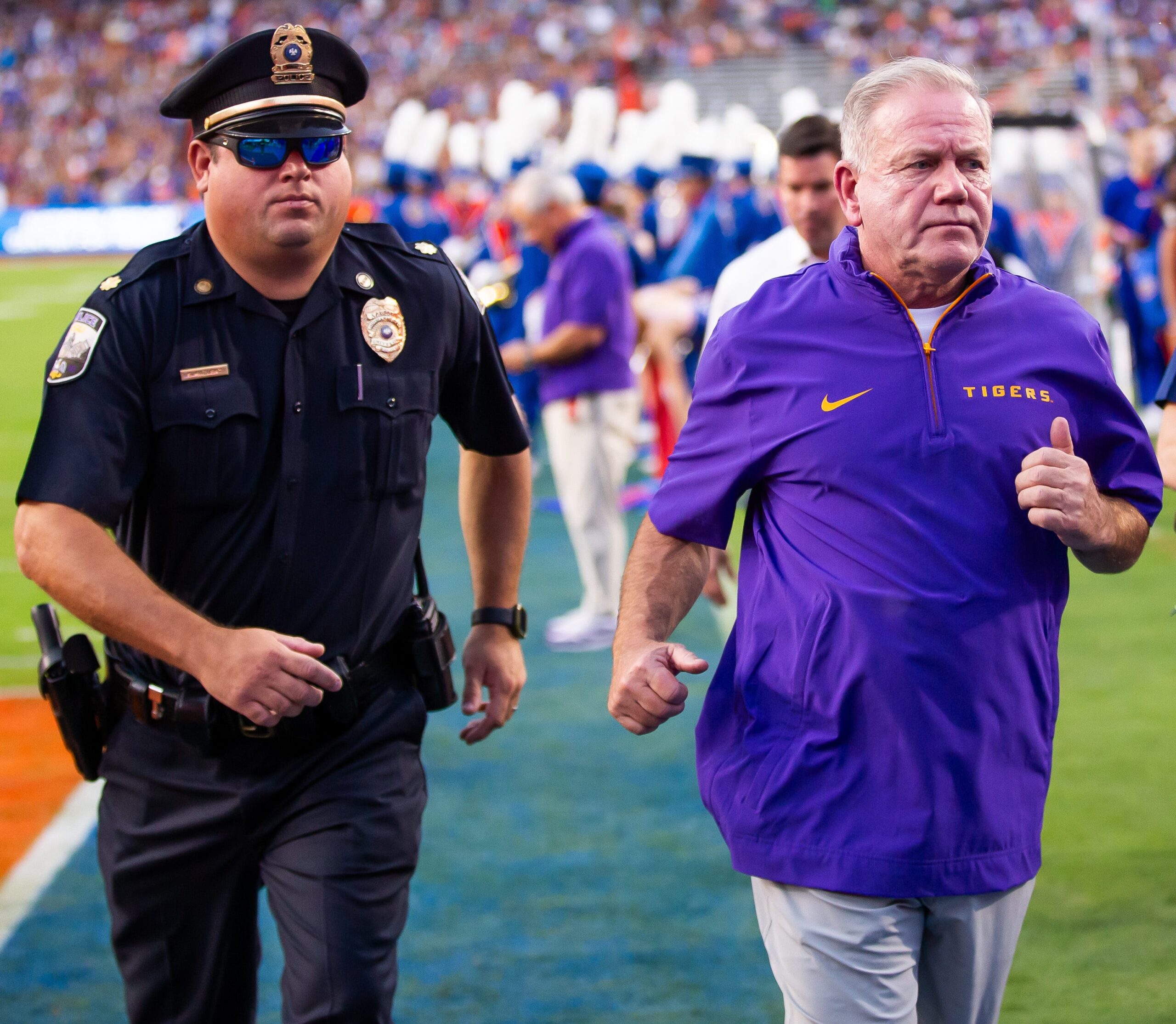 LSU Tigers head coach Brian Kelly runs off the field after the first half at Ben Hill Griffin Stadium in Gainesville, FL on Saturday, November 16, 2024.