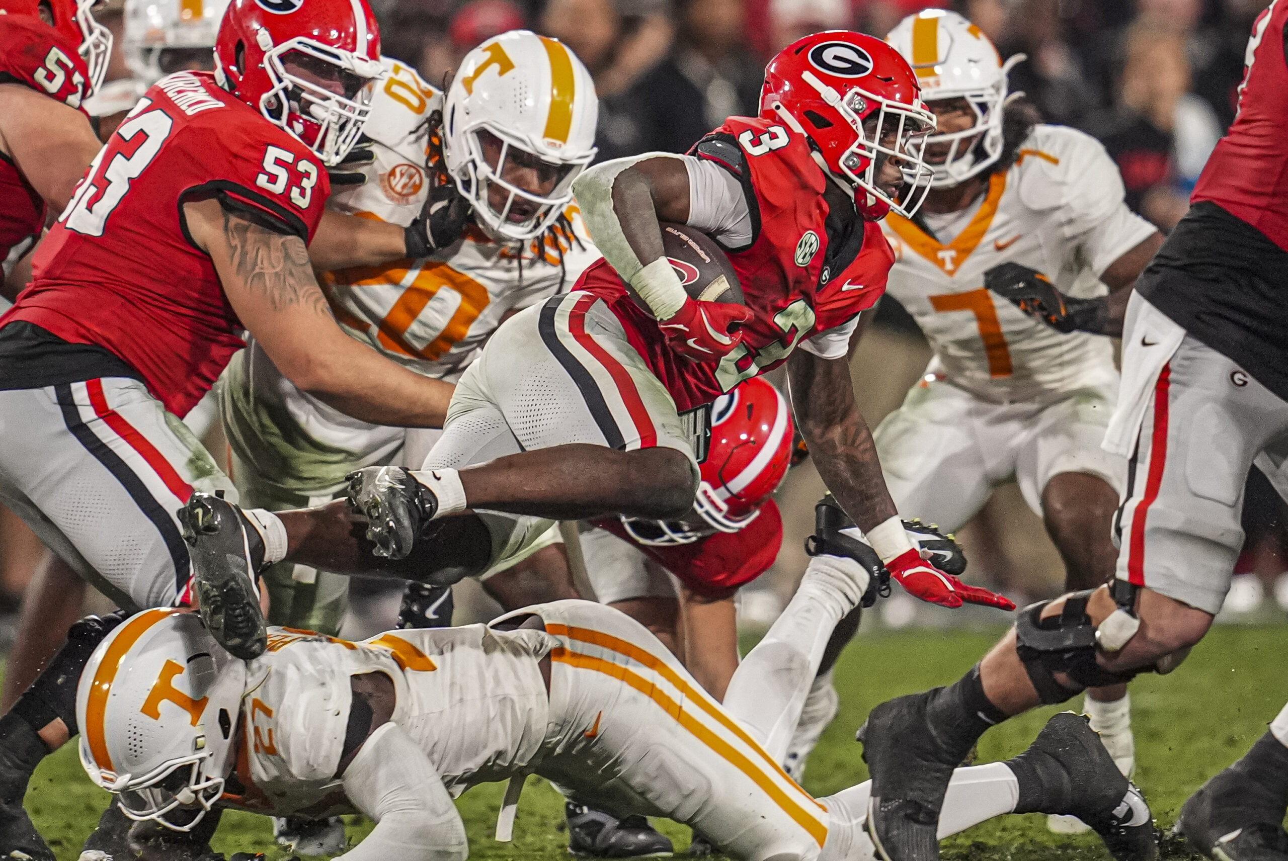 Nov 16, 2024; Athens, Georgia, USA; Georgia Bulldogs running back Nate Frazier (3) is tackled by Tennessee Volunteers defensive lineman James Pearce Jr. (27) during the first half at Sanford Stadium.