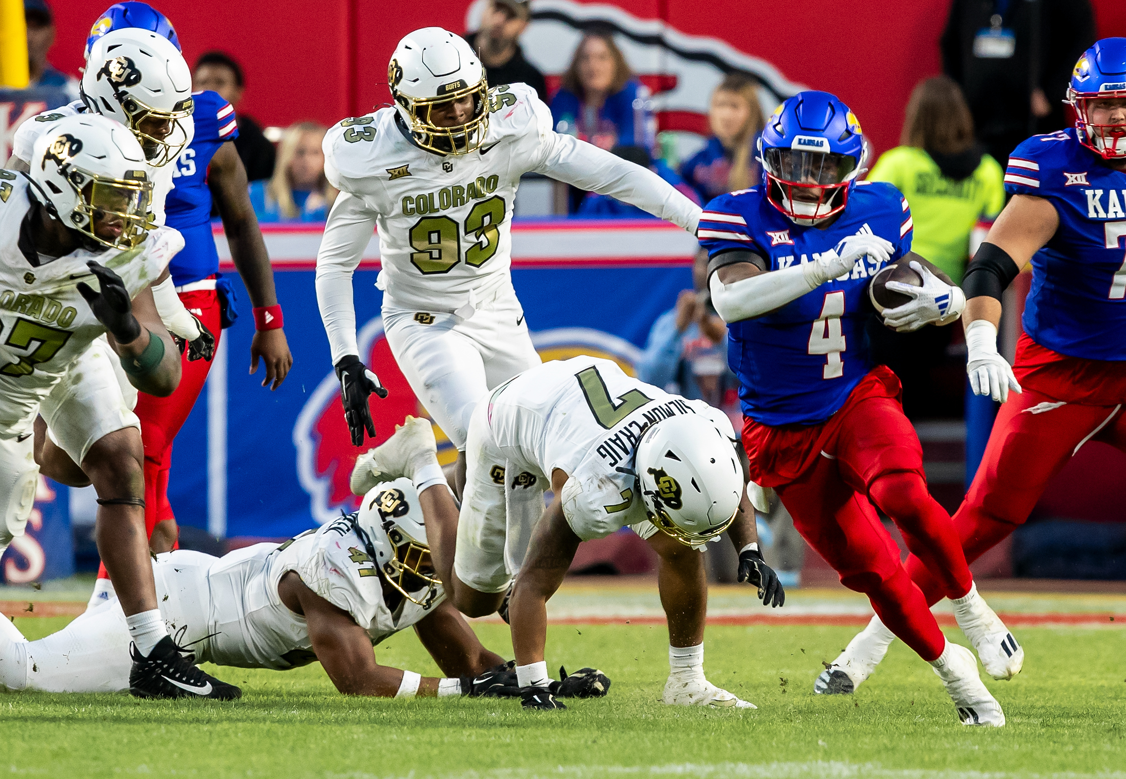Nov 23, 2024; Kansas City, Missouri, USA; Kansas running back Devin Neal (4) during the edges around the defense during the 3rd quarter between the Kansas Jayhawks and the Colorado Buffaloes at GEHA Field at Arrowhead Stadium.