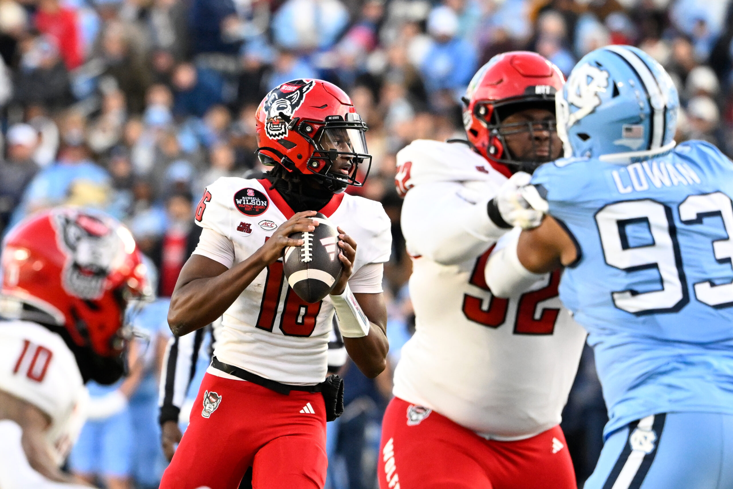Nov 30, 2024; Chapel Hill, North Carolina, USA; North Carolina State Wolfpack quarterback CJ Bailey (16) looks to pass in the first quarter at Kenan Memorial Stadium.