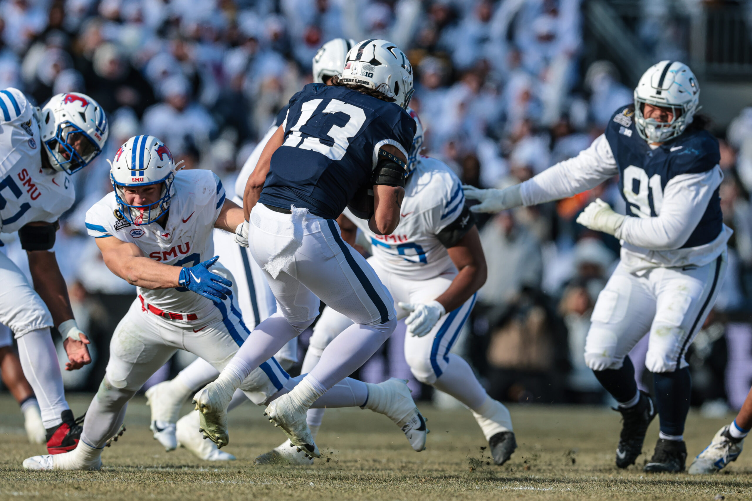 Dec 21, 2024; University Park, Pennsylvania, USA; Penn State Nittany Lions linebacker Tony Rojas (13) intercepts during the first half against the Southern Methodist Mustangs at Beaver Stadium.