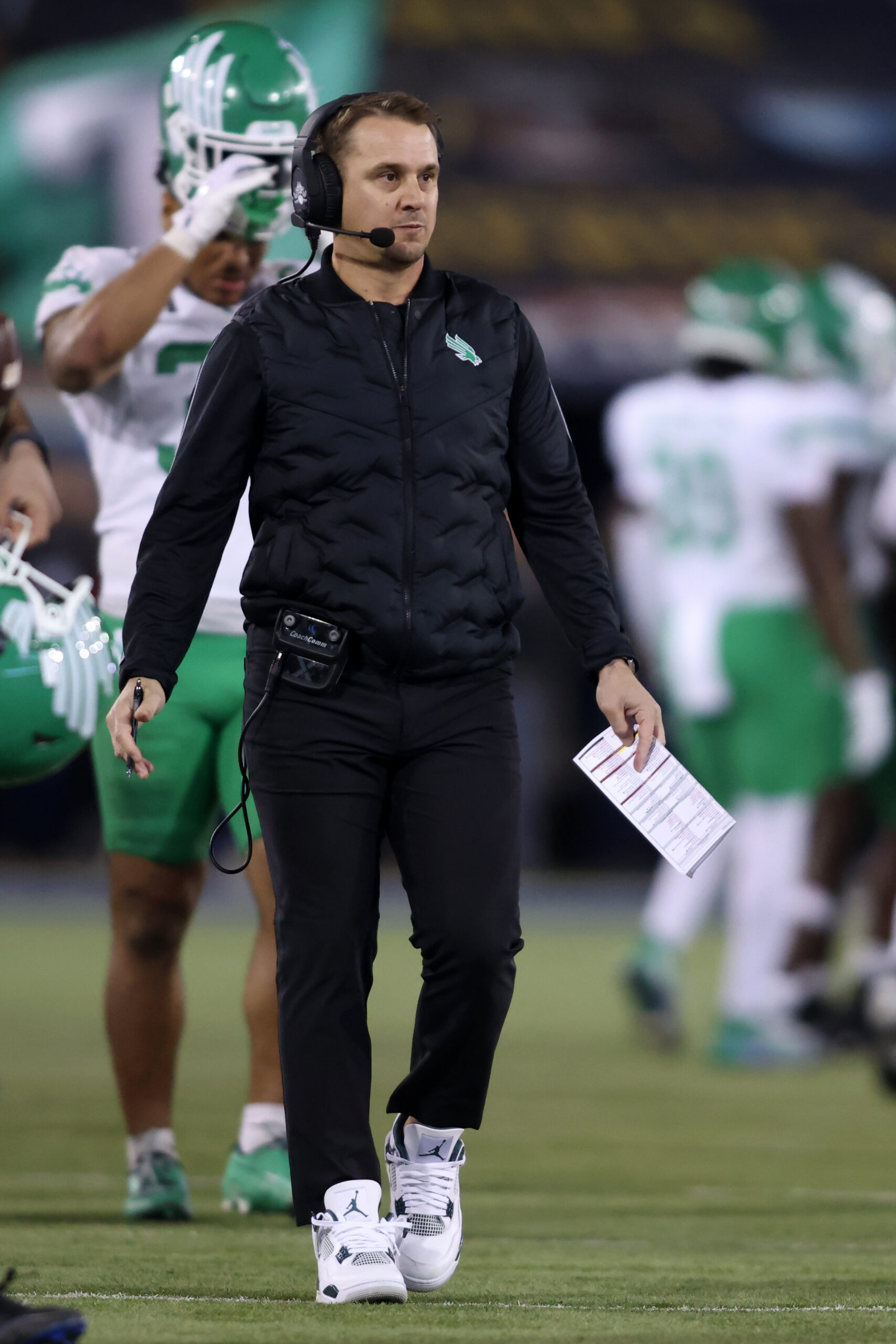 Jan 3, 2025; Dallas, TX, USA; North Texas Mean Green head coach Eric Morris walks on the field during the game against the Texas State Bobcats at Gerald J. Ford Stadium. Mandatory Credit: Tim Heitman-Imagn Images