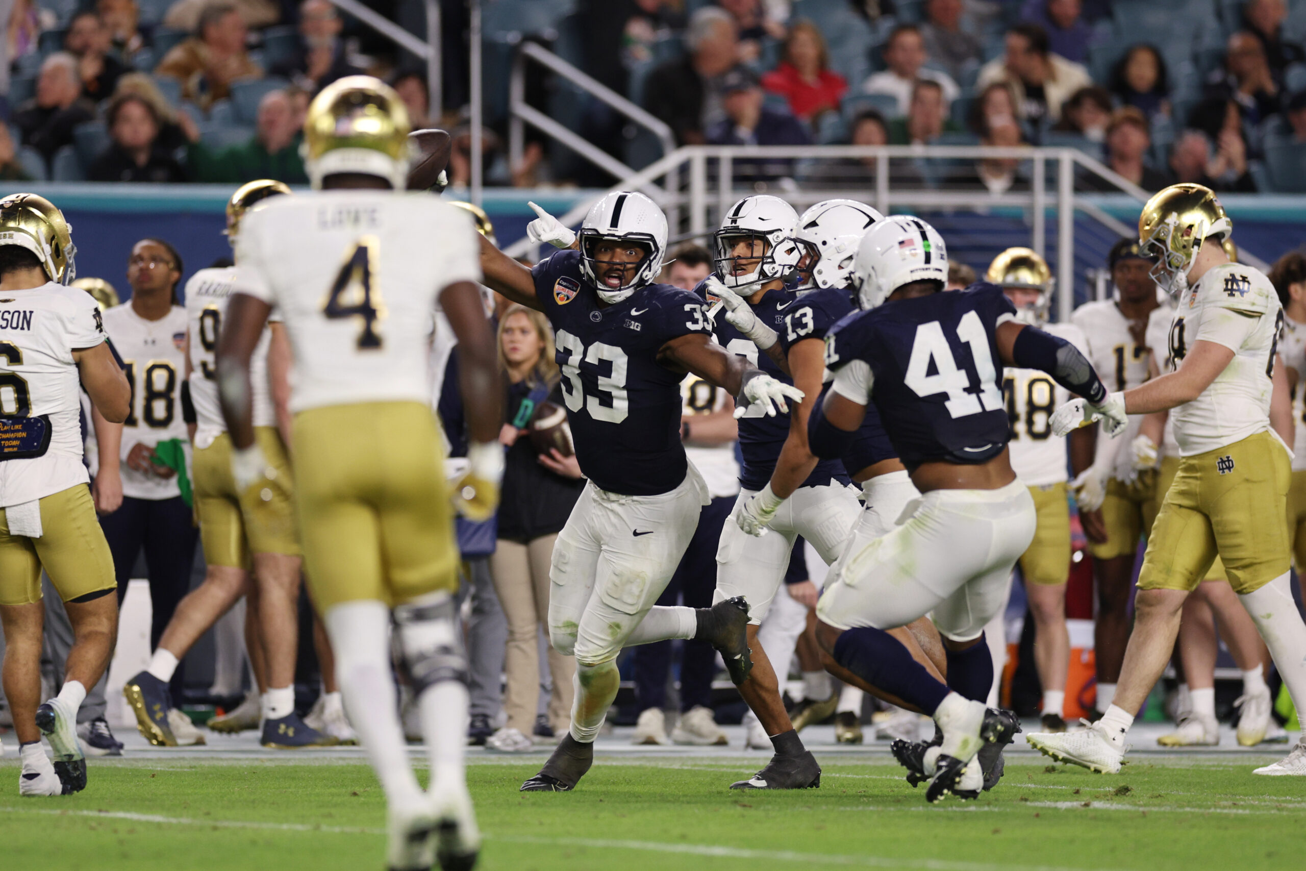 Jan 9, 2025; Miami, FL, USA; Penn State Nittany Lions defensive end Dani Dennis-Sutton (33) intercepts the ball in the second half against the Notre Dame Fighting Irish in the Orange Bowl at Hard Rock Stadium.