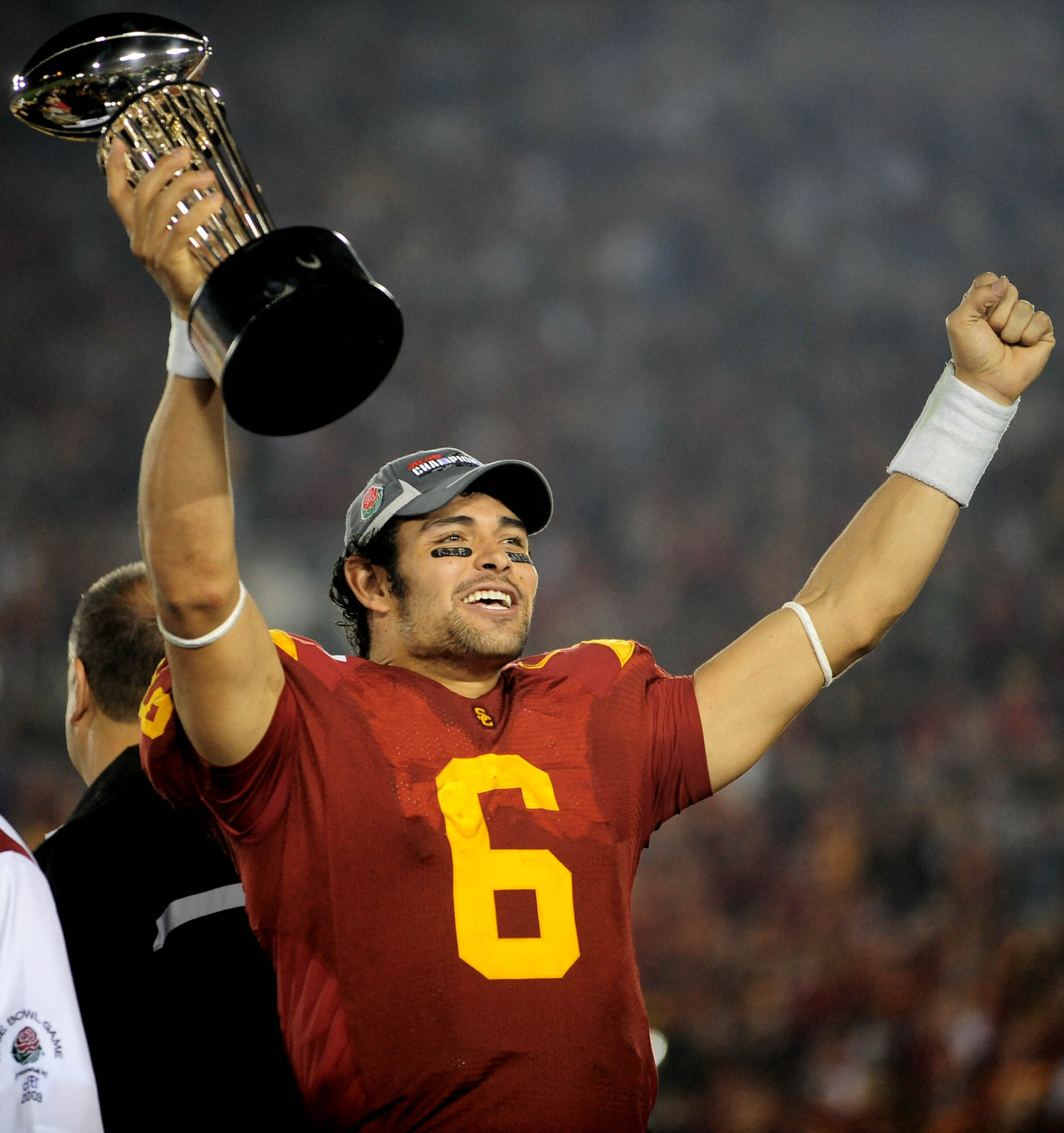 Jan 1, 2009; Pasadena, CA, USA; Southern California Trojans quarterback Mark Sanchez celebrates with the trophy after defeating the Penn State Nittany Lions during the 2009 Rose Bowl game at the Rose Bowl. The Trojans defeated the Nittany Lions 38-24.