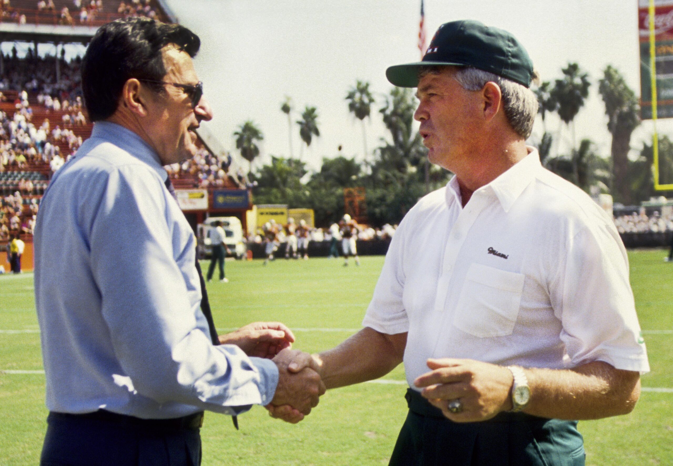 Oct 12, 1991; Miami, FL, USA; FILE PHOTO; Miami Hurricanes head coach Dennis Erickson (right) shakes hands with Penn State Nittany Lions head coach Joe Paterno prior to the game. Miami defeated Penn State 26-20 at the Orange Bowl.