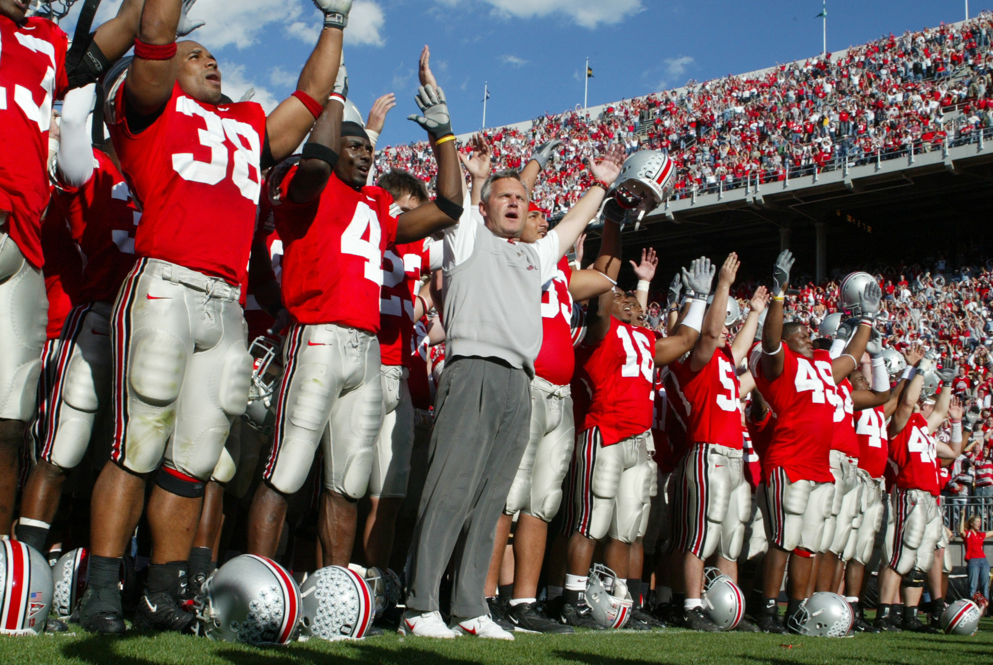 Oct 30, 2004; Columbus, OH, USA; Ohio State Buckeyes head coach Jim Tressel signs 'Carmen Ohio' the Alma Mater with his team after the game against Penn State Nittany Lions at Ohio Stadium .