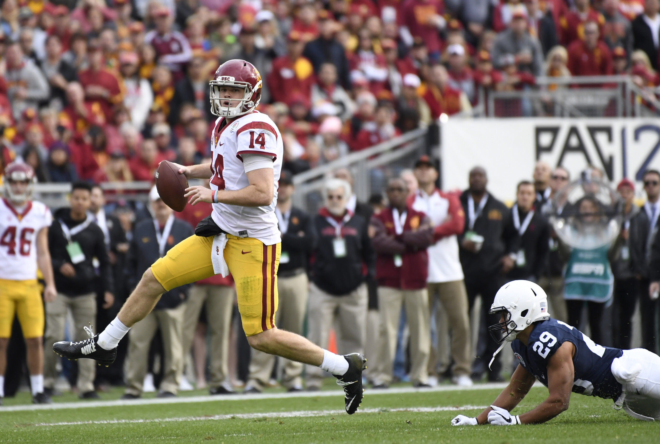 Jan 2, 2017; Pasadena, CA, USA; USC Trojans quarterback Sam Darnold (14) makes a pass under pressure from Penn State Nittany Lions cornerback John Reid (29) during the first quarter of the 2017 Rose Bowl game at Rose Bowl. 
