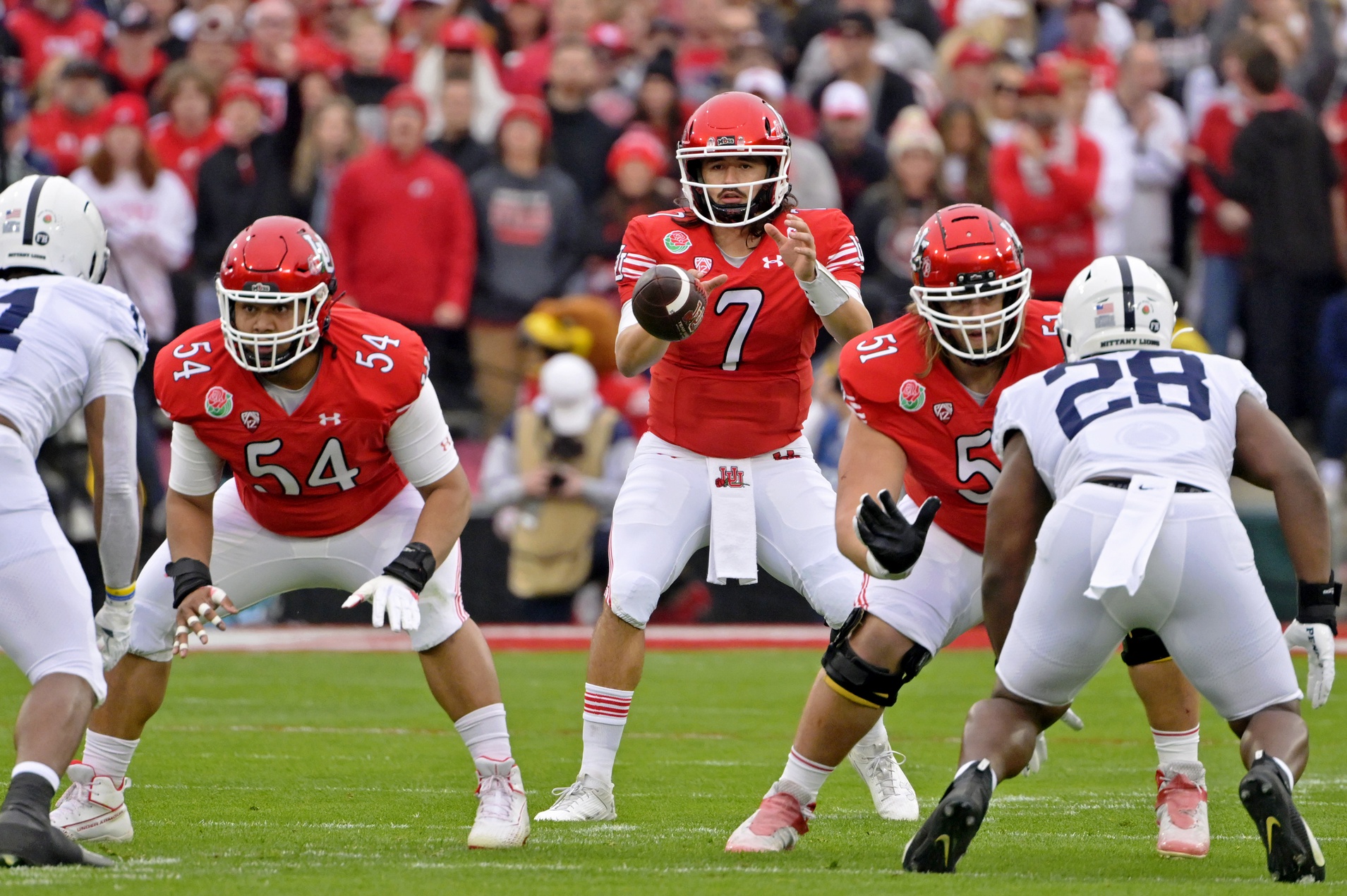 Jan 2, 2023; Pasadena, California, USA; Utah Utes quarterback Cameron Rising (7) takes the snap against the Penn State Nittany Lions during the first half at Rose Bowl.