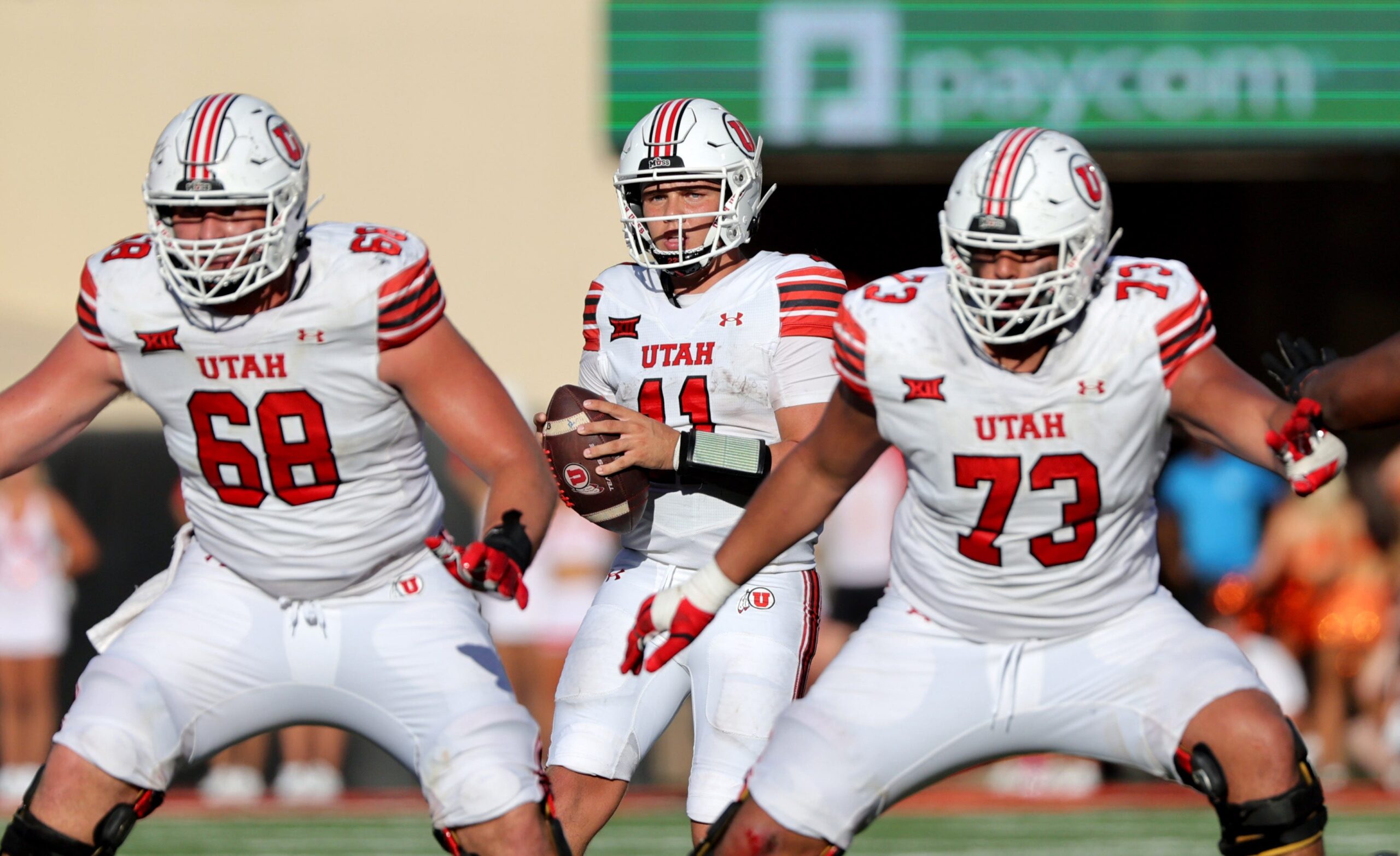 Utah's Isaac Wilson (11) looks to throw a pass in the second half of the college football between the Oklahoma State University Cowboys and the Utah Utes at Boone Pickens Stadium in Stillwater, Okla., Saturday, Sept., 21, 2024.