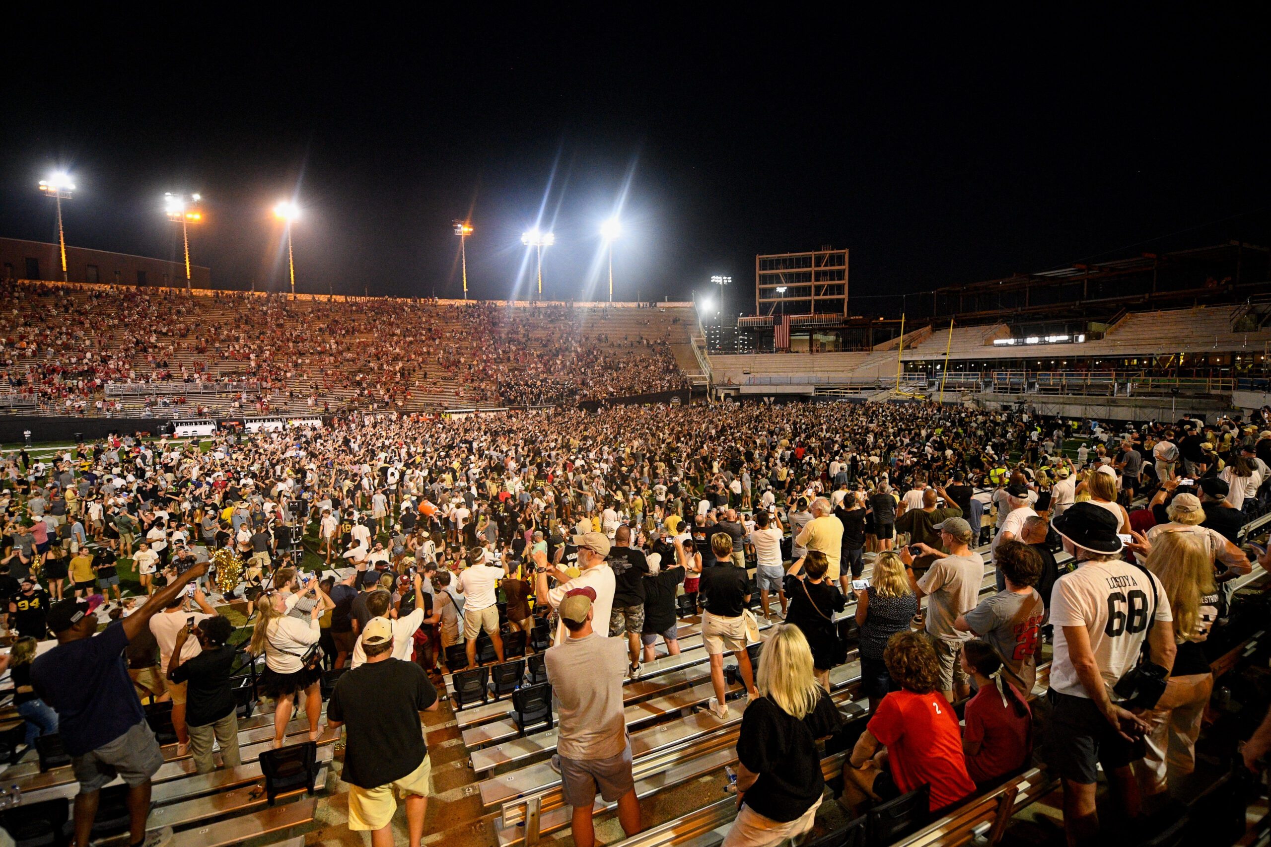 Oct 5, 2024; Nashville, Tennessee, USA; Vanderbilt Commodores fans rush the field after a victory over the Alabama Crimson Tide at FirstBank Stadium.