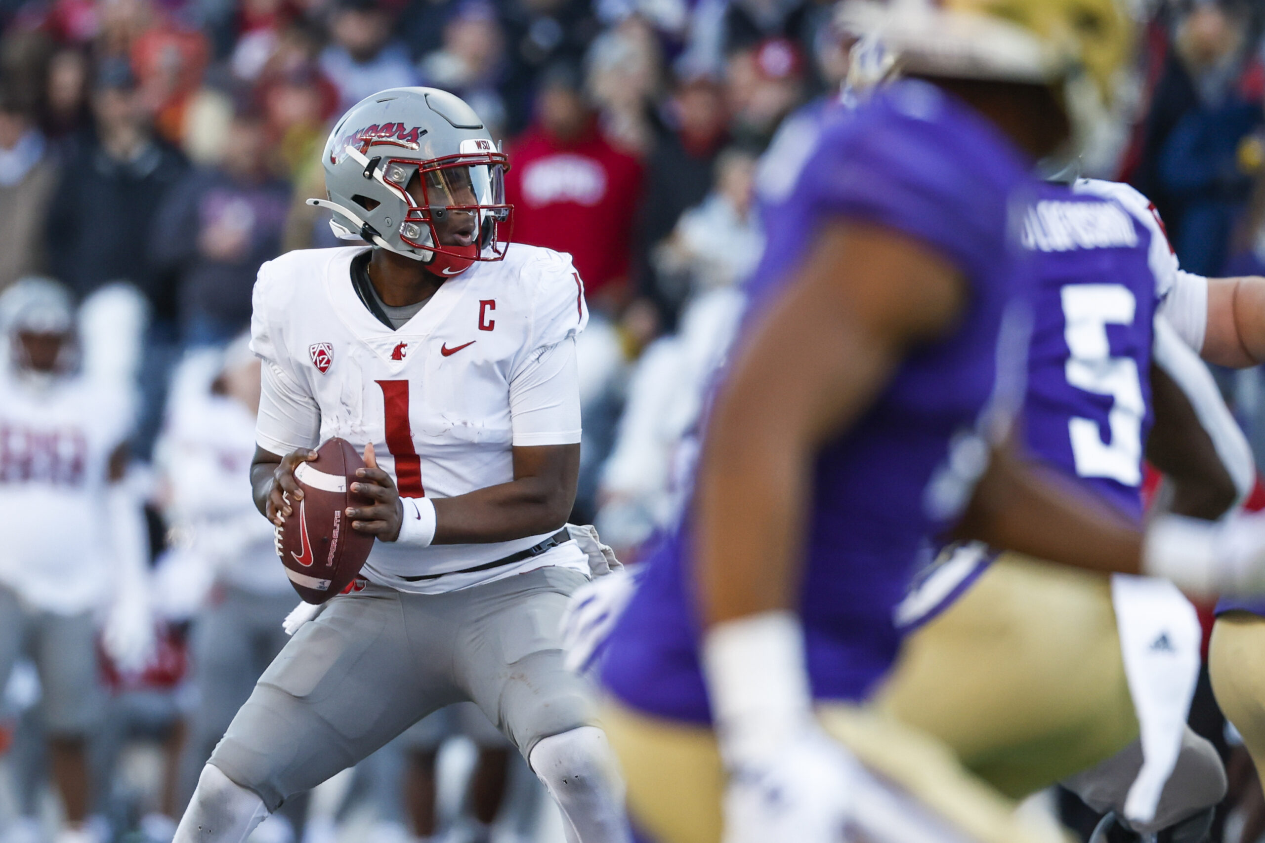 Nov 25, 2023; Seattle, Washington, USA; Washington State Cougars quarterback Cameron Ward (1) passes against the Washington Huskies during the second quarter at Alaska Airlines Field at Husky Stadium.