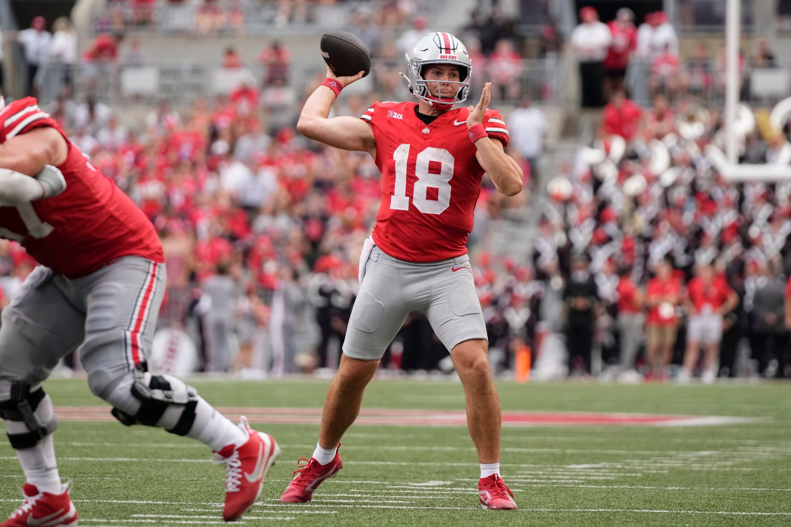 Aug 31, 2024; Columbus, OH, USA; Ohio State Buckeyes quarterback Will Howard (18) throws during the second half of the NCAA football game against the Akron Zips at Ohio Stadium. Ohio State won 52-6.