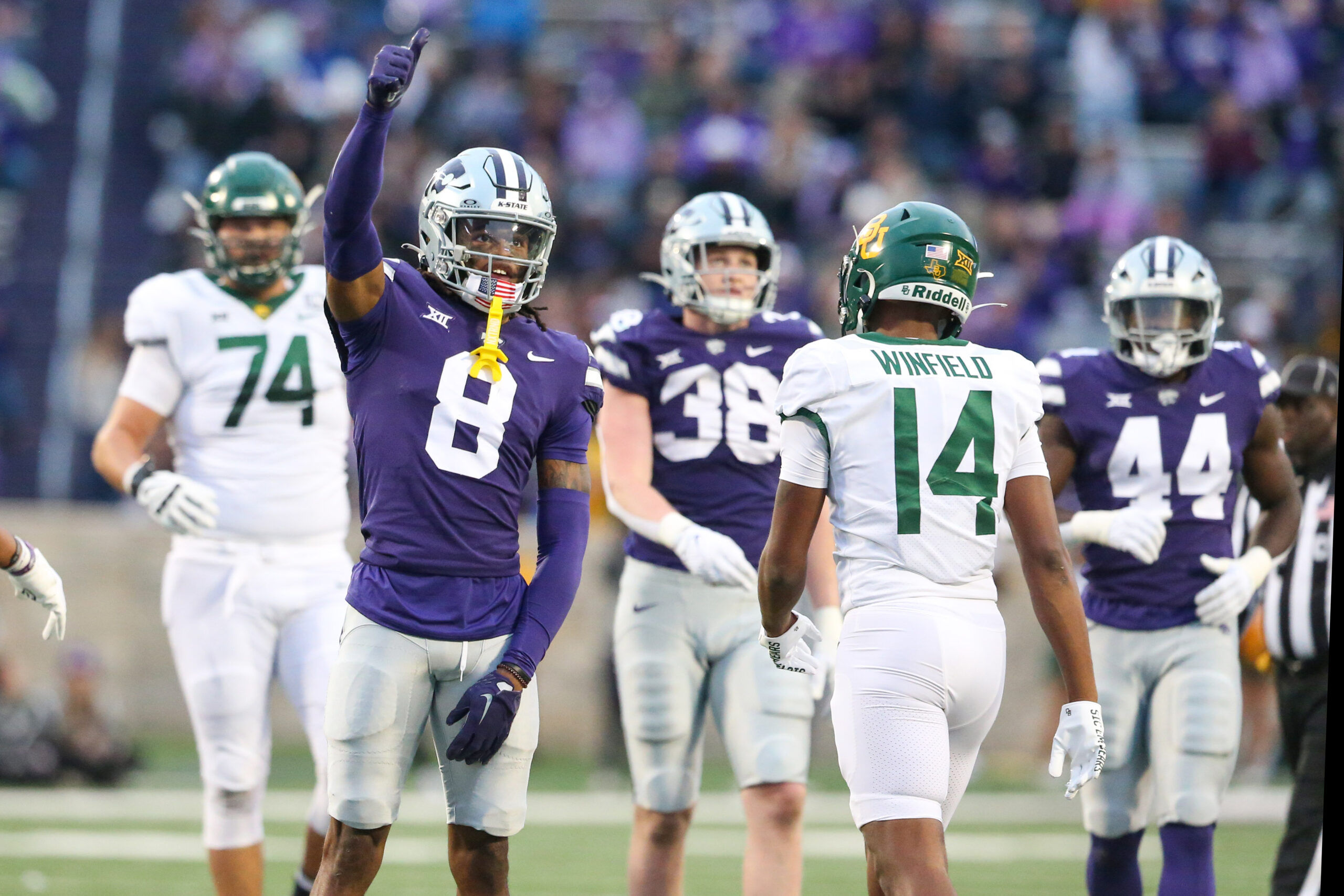 Nov 11, 2023; Manhattan, Kansas, USA; Kansas State Wildcats cornerback Will Lee III (8) celebrates a stop during the fourth quarter against the Baylor Bears at Bill Snyder Family Football Stadium.