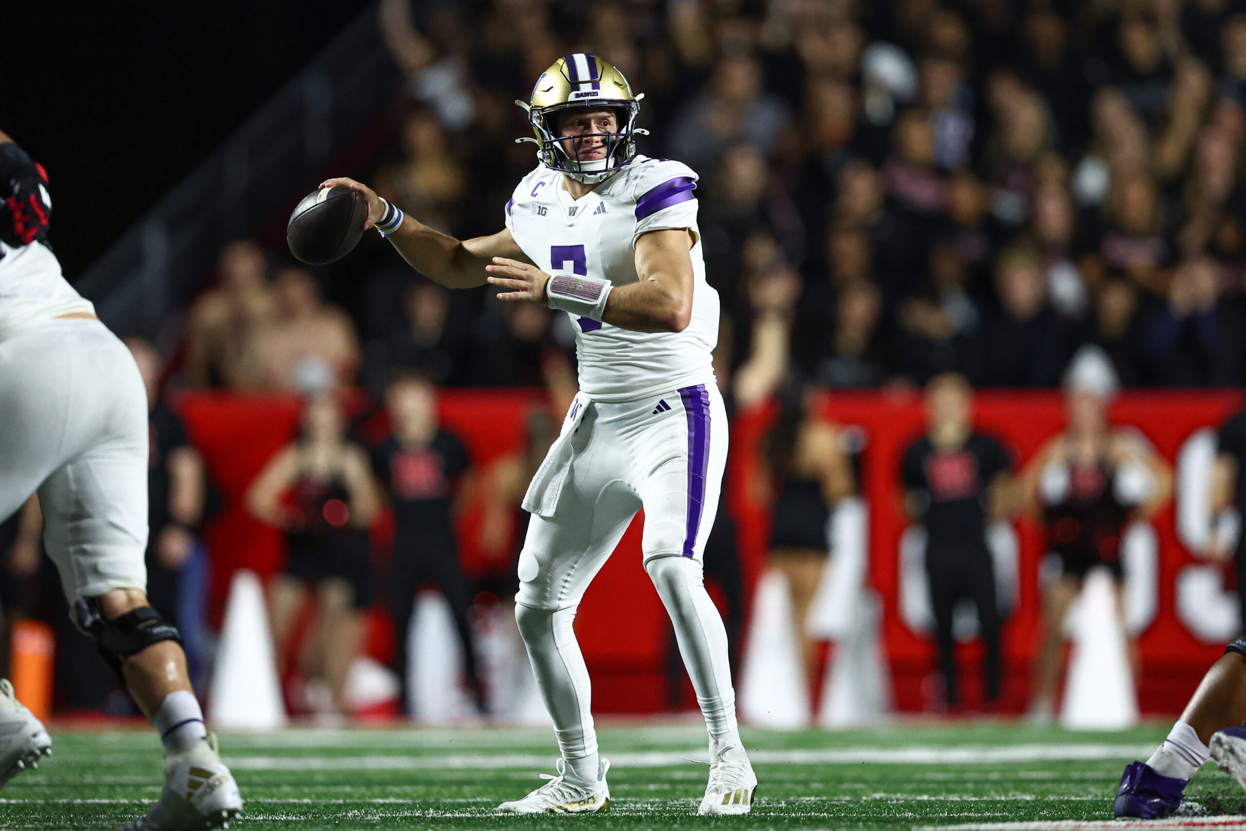 Sep 27, 2024; Piscataway, New Jersey, USA; Washington Huskies quarterback Will Rogers (7) throws the ball against the Rutgers Scarlet Knights during the first half at SHI Stadium.