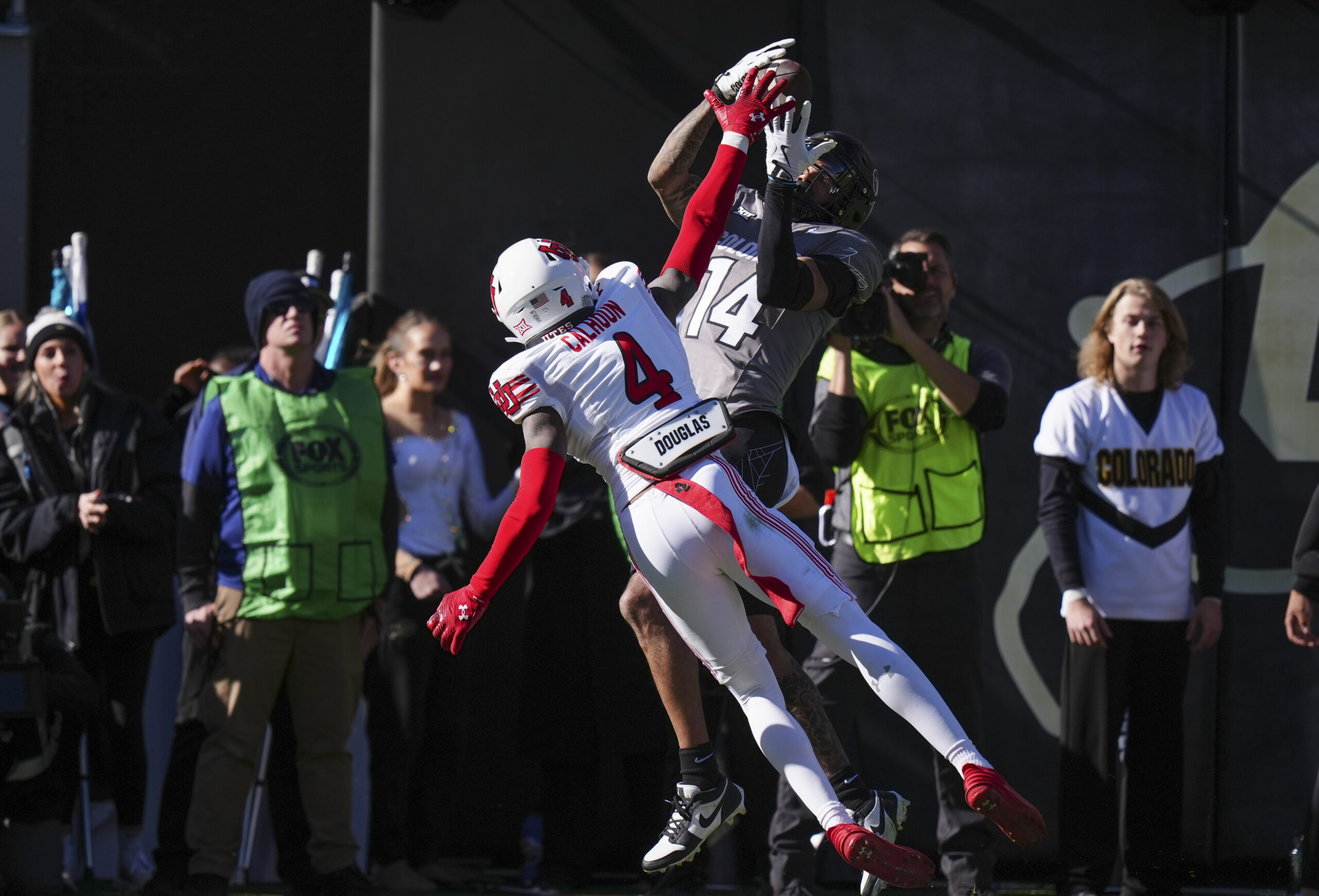 Nov 16, 2024; Boulder, Colorado, USA; Colorado Buffaloes wide receiver Will Sheppard (14) pulls in a touchdown past Utah Utes cornerback Cameron Calhoun (4) in the second quarter at Folsom Field.