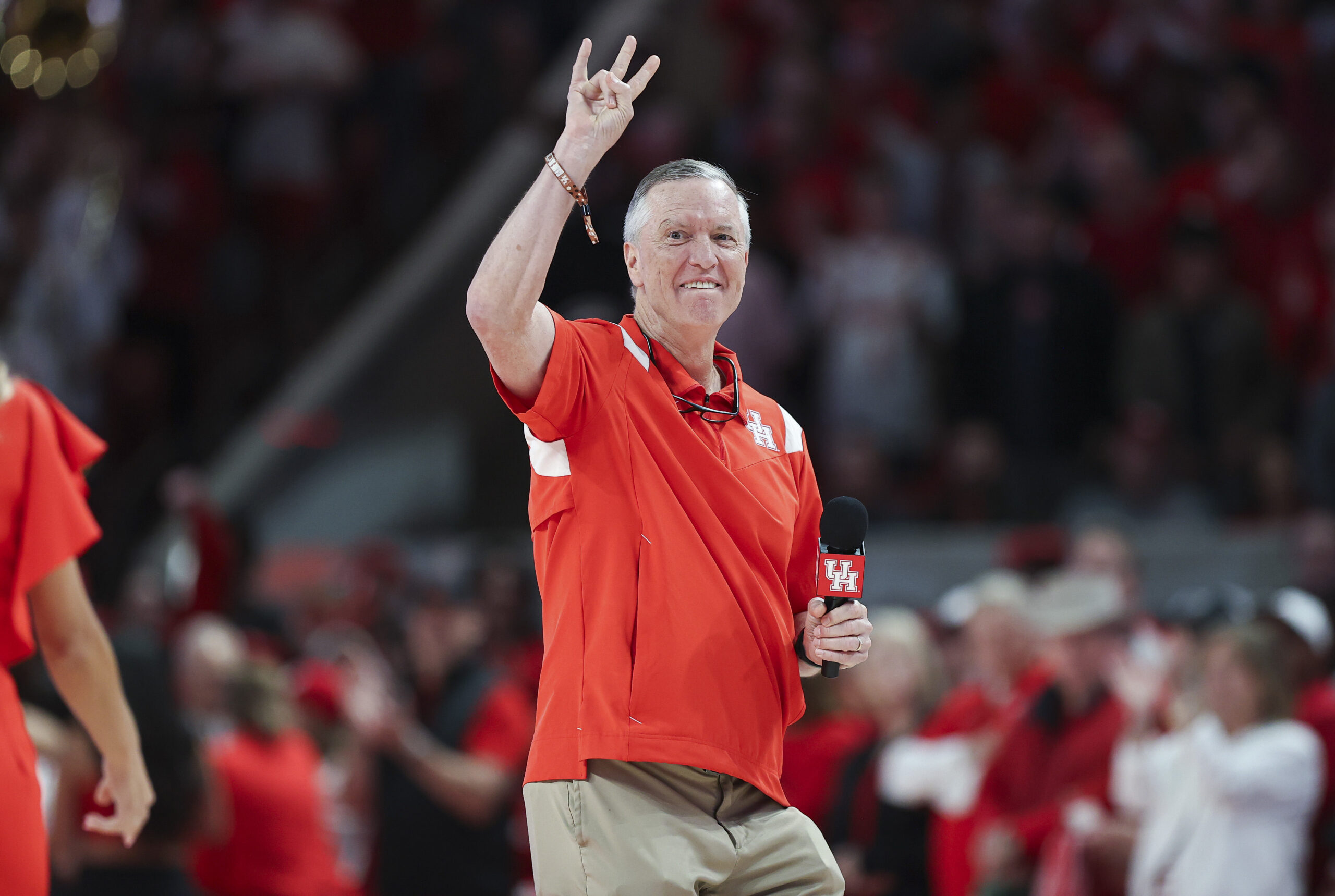 Mar 9, 2024; Houston, Texas, USA; Houston Cougars football head coach Willie Fritz addresses the crowd before the game against the Kansas Jayhawks at Fertitta Center.