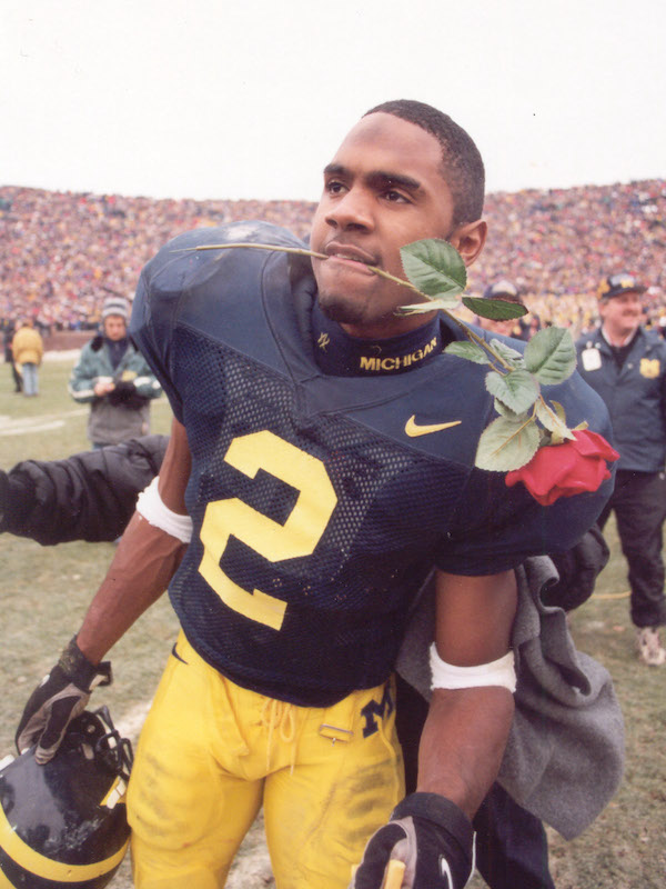 #2 Charles Woodson celebrates Big Ten championship following 20-14 win versus Ohio State in 1997.