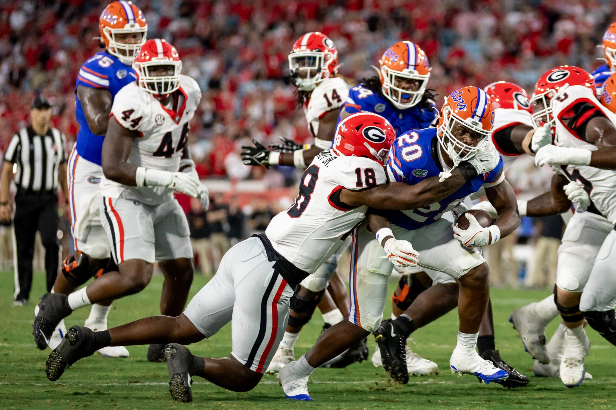 Georgia Bulldogs linebacker Xavian Sorey Jr. (18) tackles Florida Gators running back Treyaun Webb (20) during the second half at Everbank Stadium in Jacksonville, FL on Saturday, October 28, 2023.