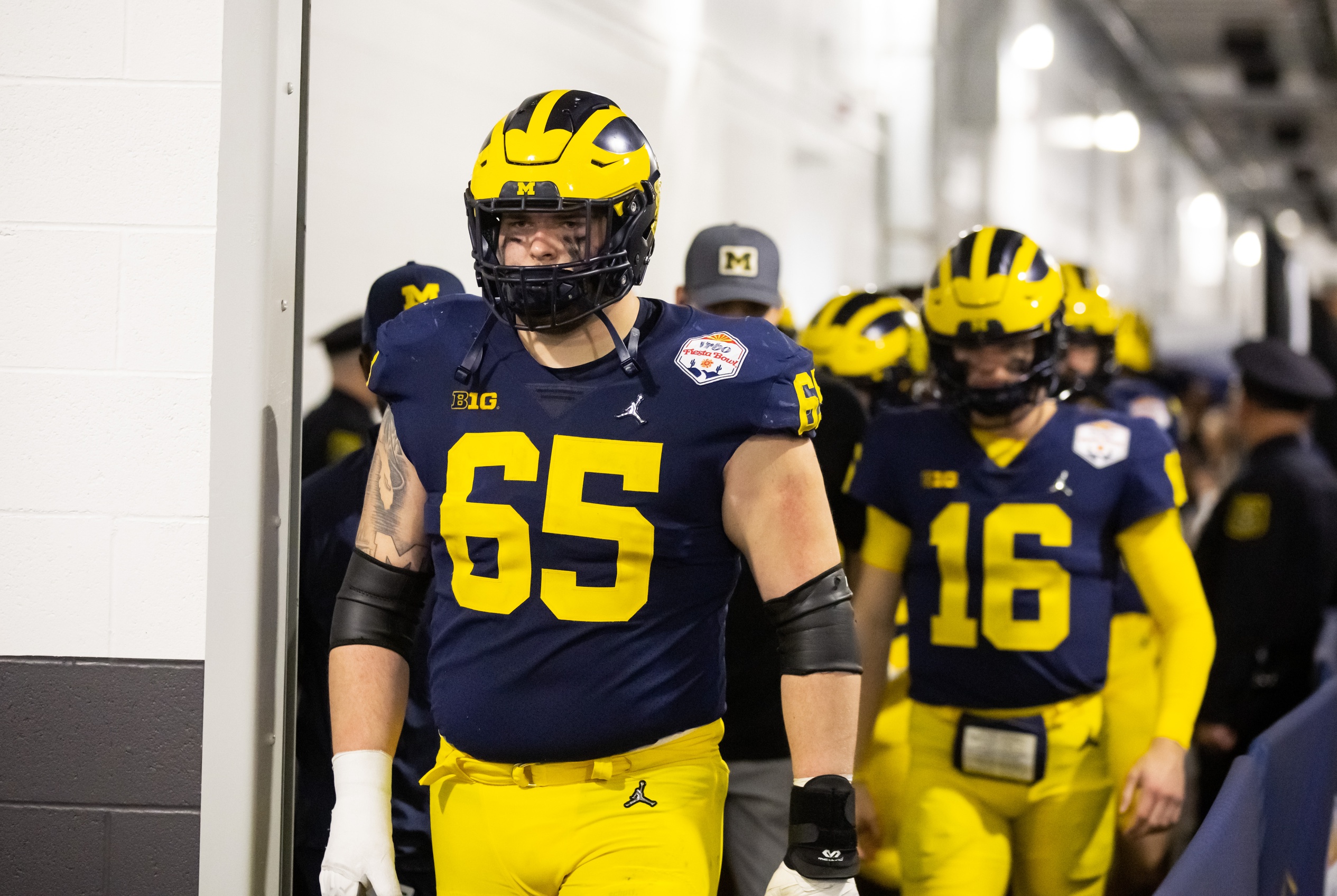 Dec 31, 2022; Glendale, Arizona, USA; Michigan Wolverines offensive lineman Zak Zinter (65) against the TCU Horned Frogs during the 2022 Fiesta Bowl at State Farm Stadium.