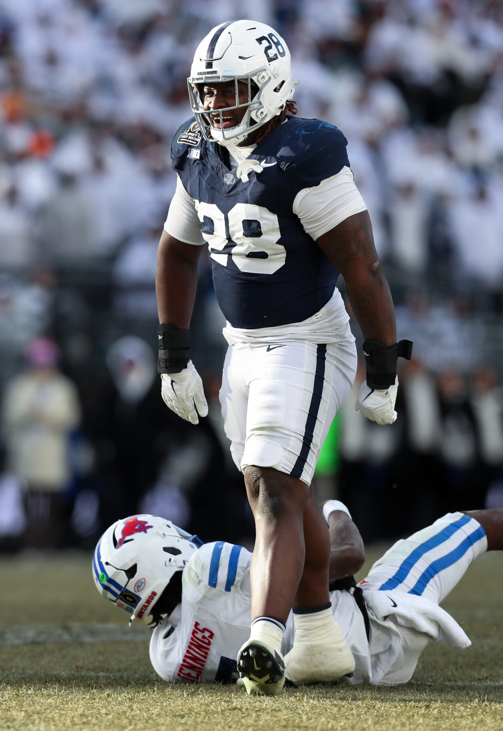 Dec 21, 2024; University Park, Pennsylvania, USA; Penn State Nittany Lions defensive tackle Zane Durant (28) reacts after sacking Southern Methodist Mustangs quarterback Kevin Jennings (7) during the fourth quarter in the first round of the College Football Playoff at Beaver Stadium.