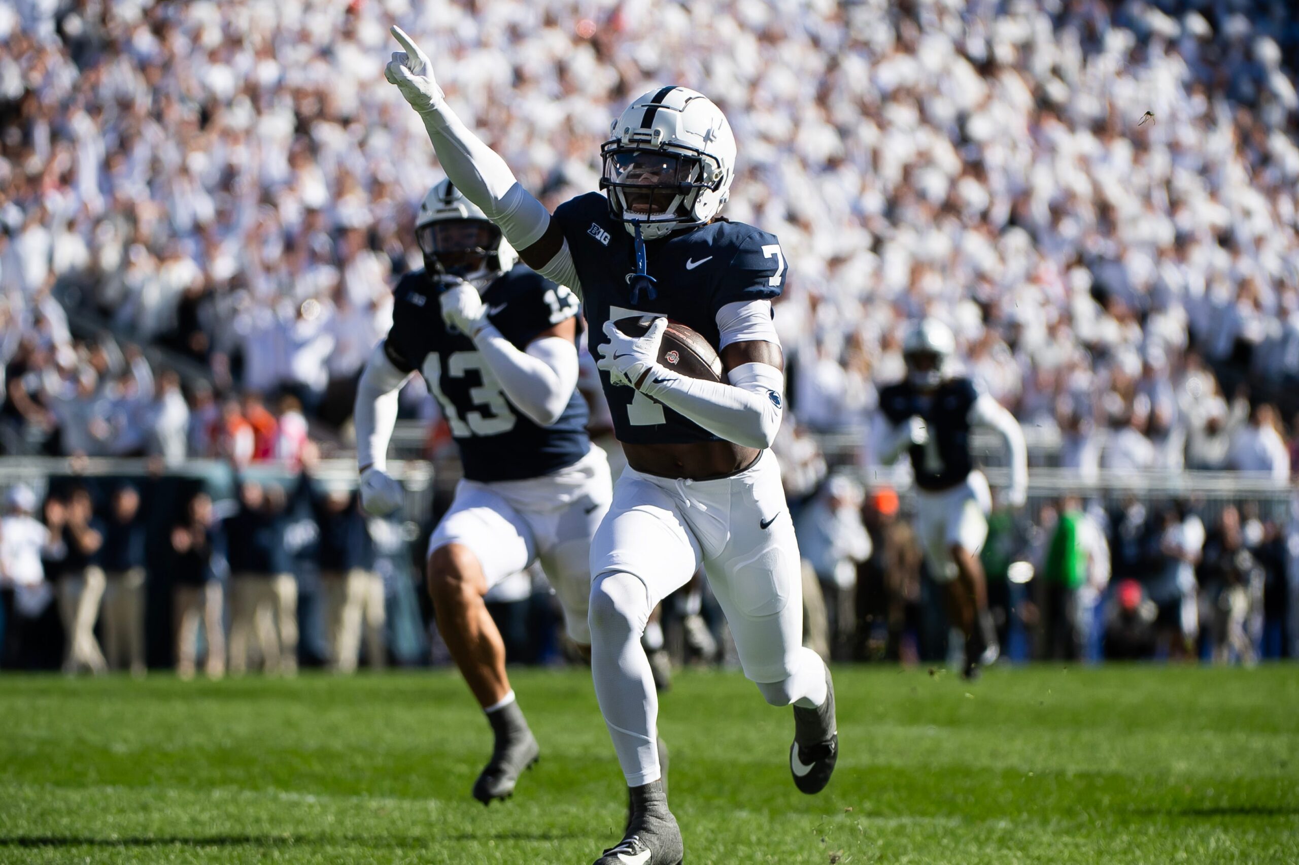 Penn State's Zion Tracy (7) returns an interception for a touchdown in the first half of an NCAA football game against Ohio State, Saturday, Nov. 2, 2024, in State College, Pa.
