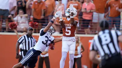 Texas Longhorns wide receiver Adonai Mitchell catches a touchdown pass in the second quarter against BYU Cougars safety Raider Damuni at Royal-Memorial Stadium on Saturday October 28
