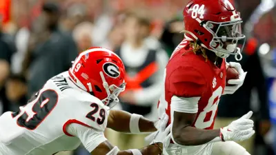 Georgia Bulldogs defensive back Christopher Smith (29) chases after Alabama Crimson Tide wide receiver Agiye Hall (84) on Monday